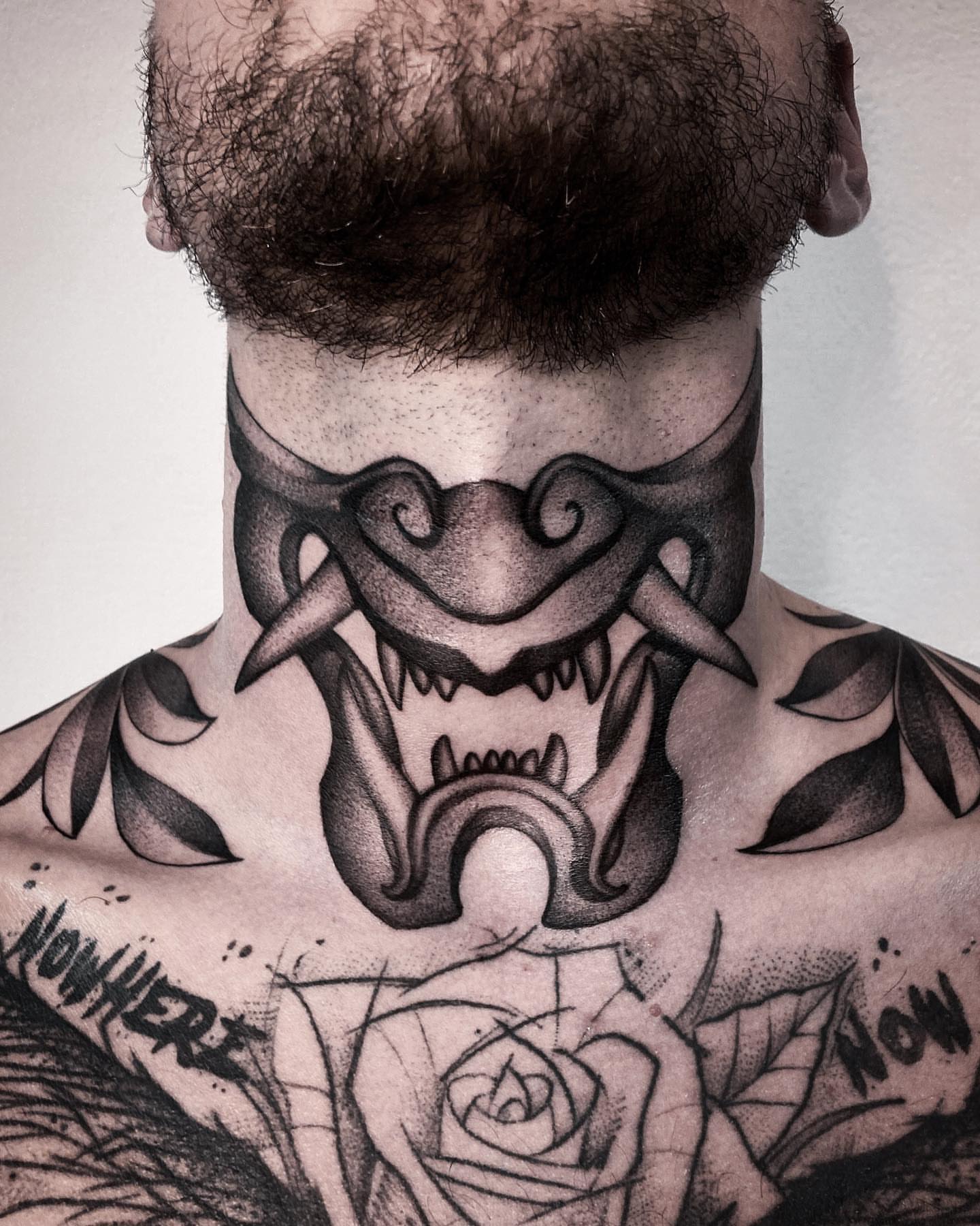 Fangs and roses dotwork tattoo on the chest by Tattoo artist in Charlotte,NC