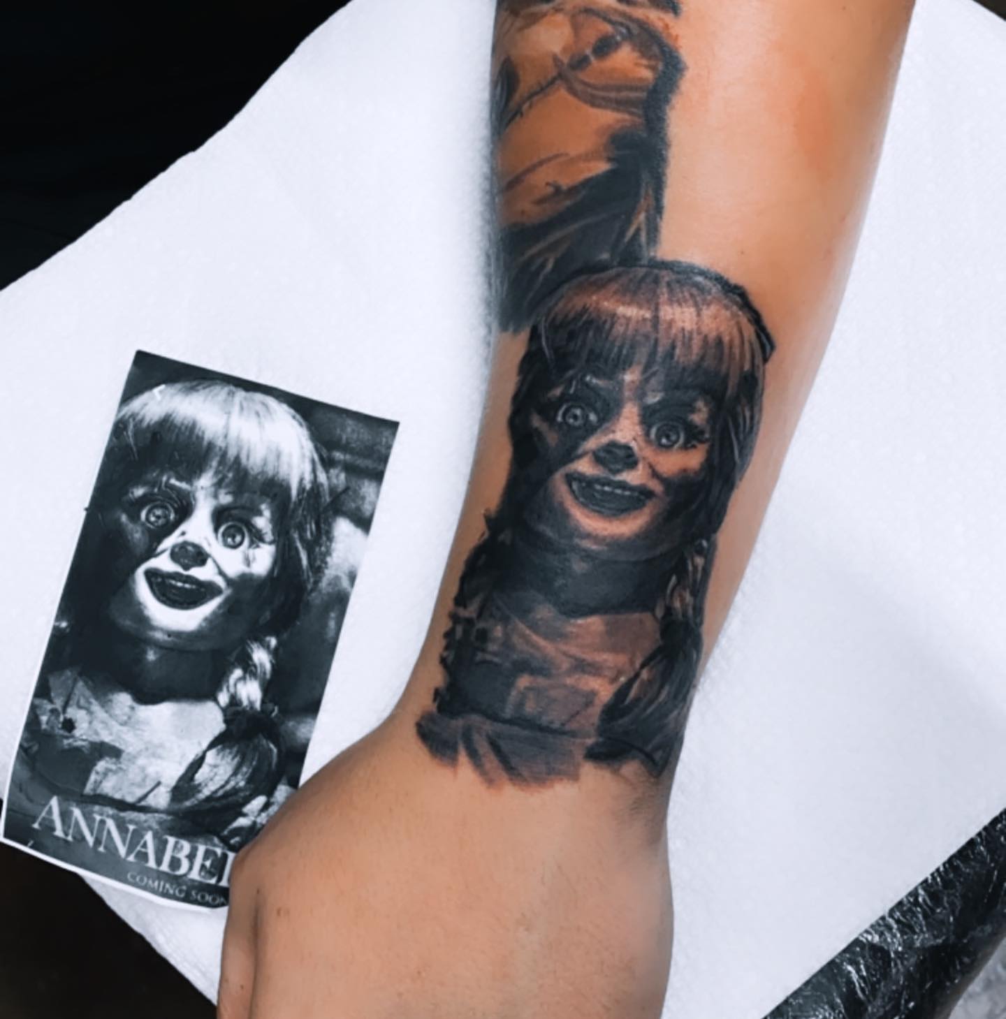 Annabelle doll realism tattoo on the forearm by ArteDeCecil