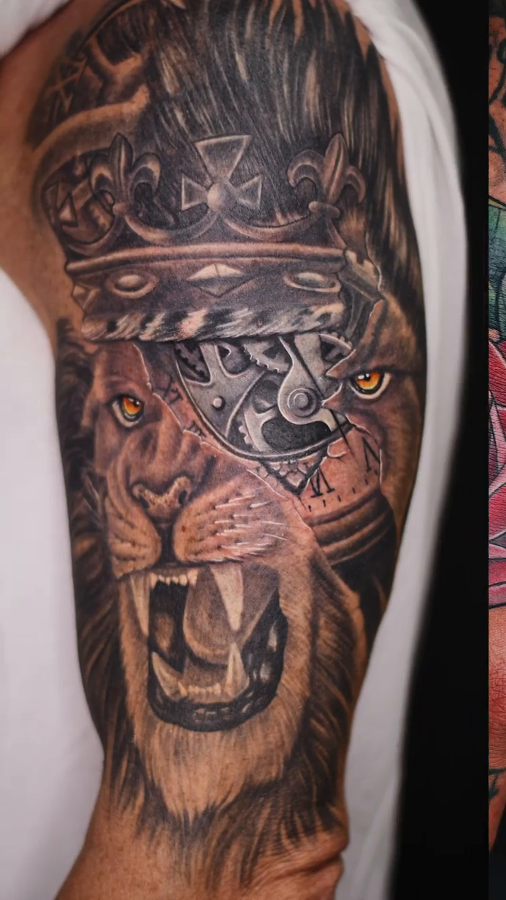 Lion with crown and gears realism tattoo by Amaury Ramirez