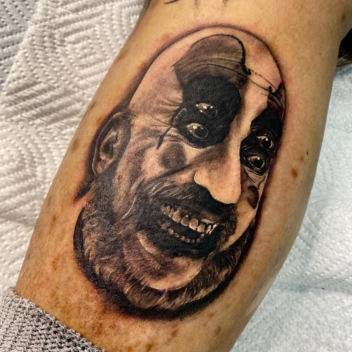 Man's face realism tattoo on the forearm by James Foltz
