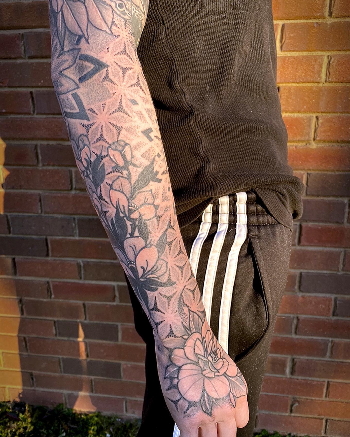 Floral design dotwork tattoo on the forearm by Josh St.germain