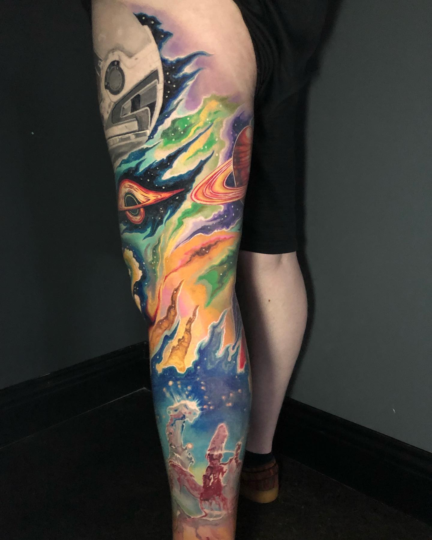 Space-themed surrealism tattoo on the leg by Kayden DiGiovanni, Addison, Texas