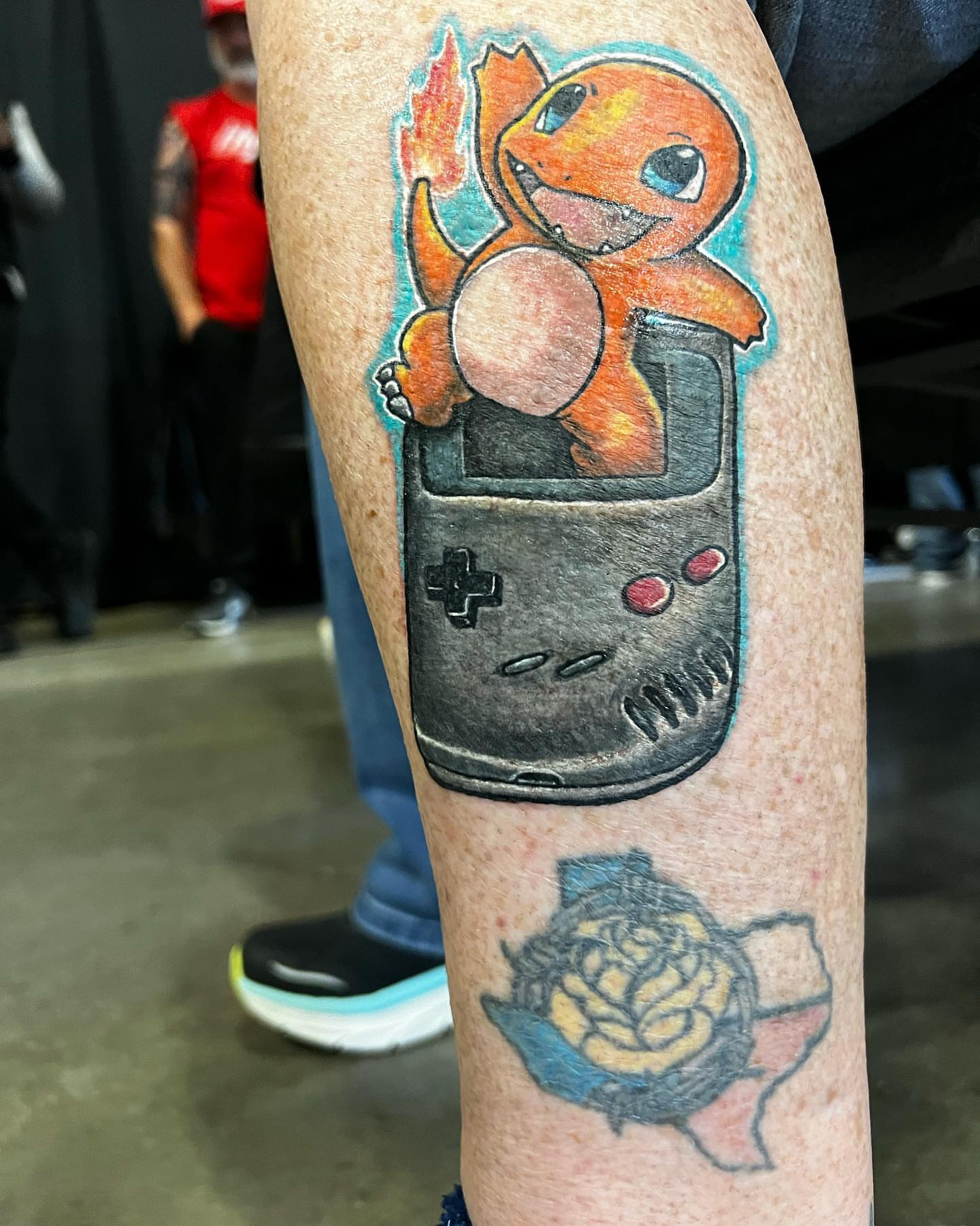 Charmander and game boy dotwork tattoo on the forearm by Glen Wallis