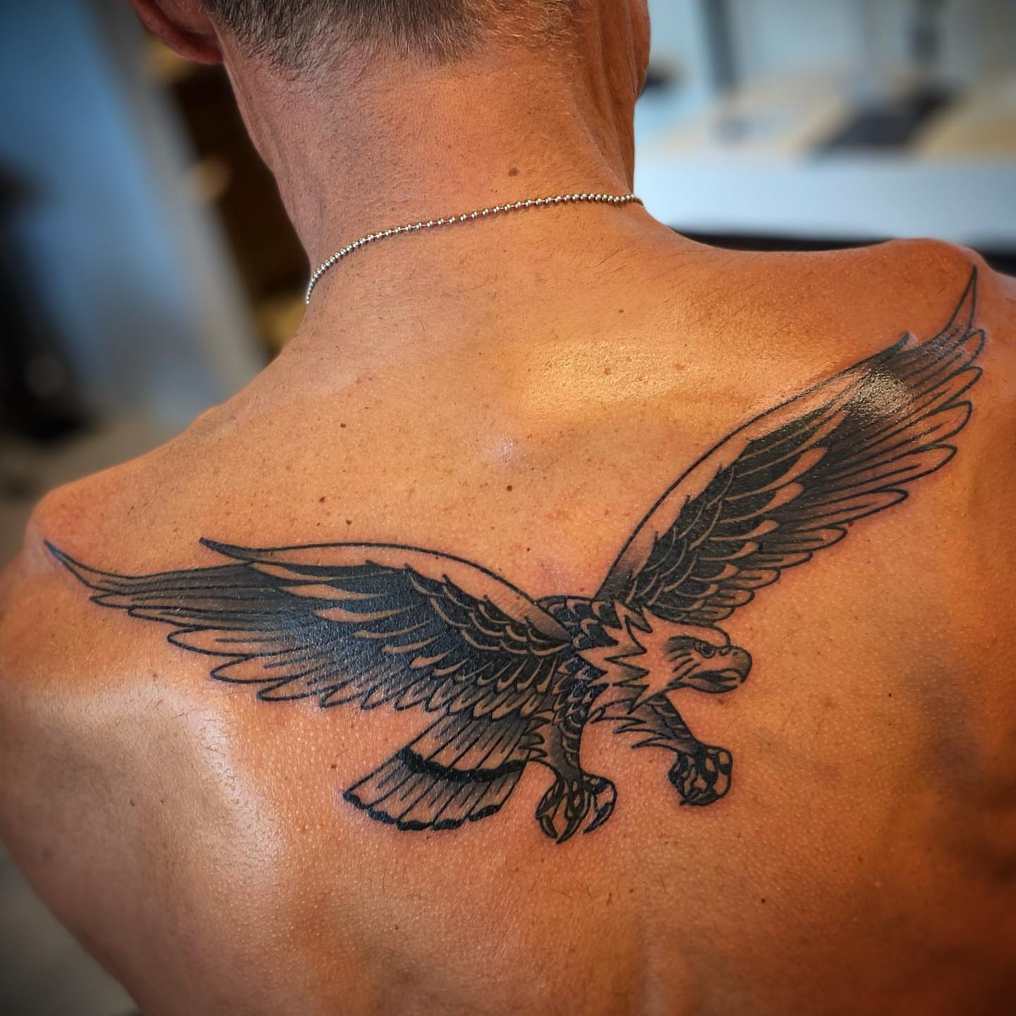 Eagle black and grey tattoo on the back by Christopher McGlone