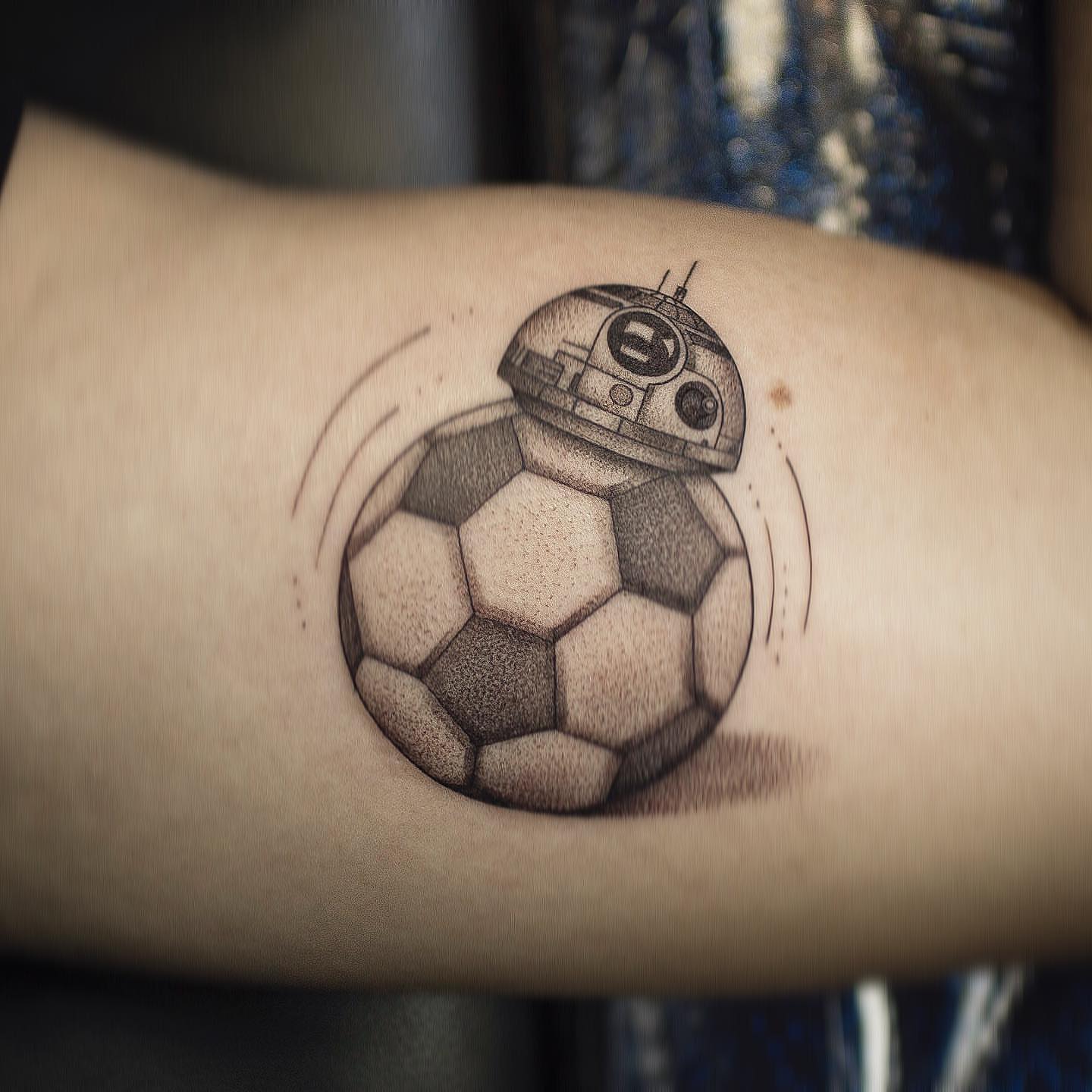 Soccer ball with BB-8 dotwork tattoo on the forearm by Luis Marrufo
