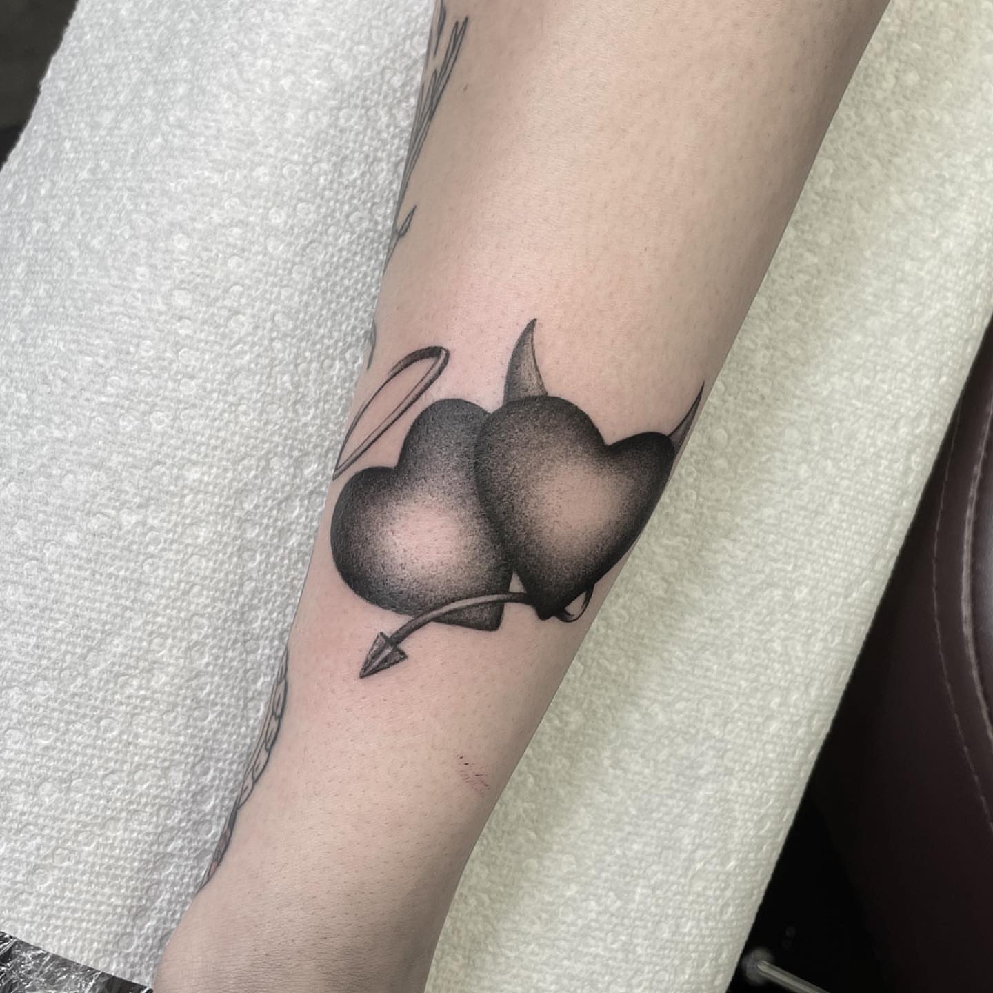 Hearts with arrow dotwork tattoo on the forearm by Jenn ★ Reid