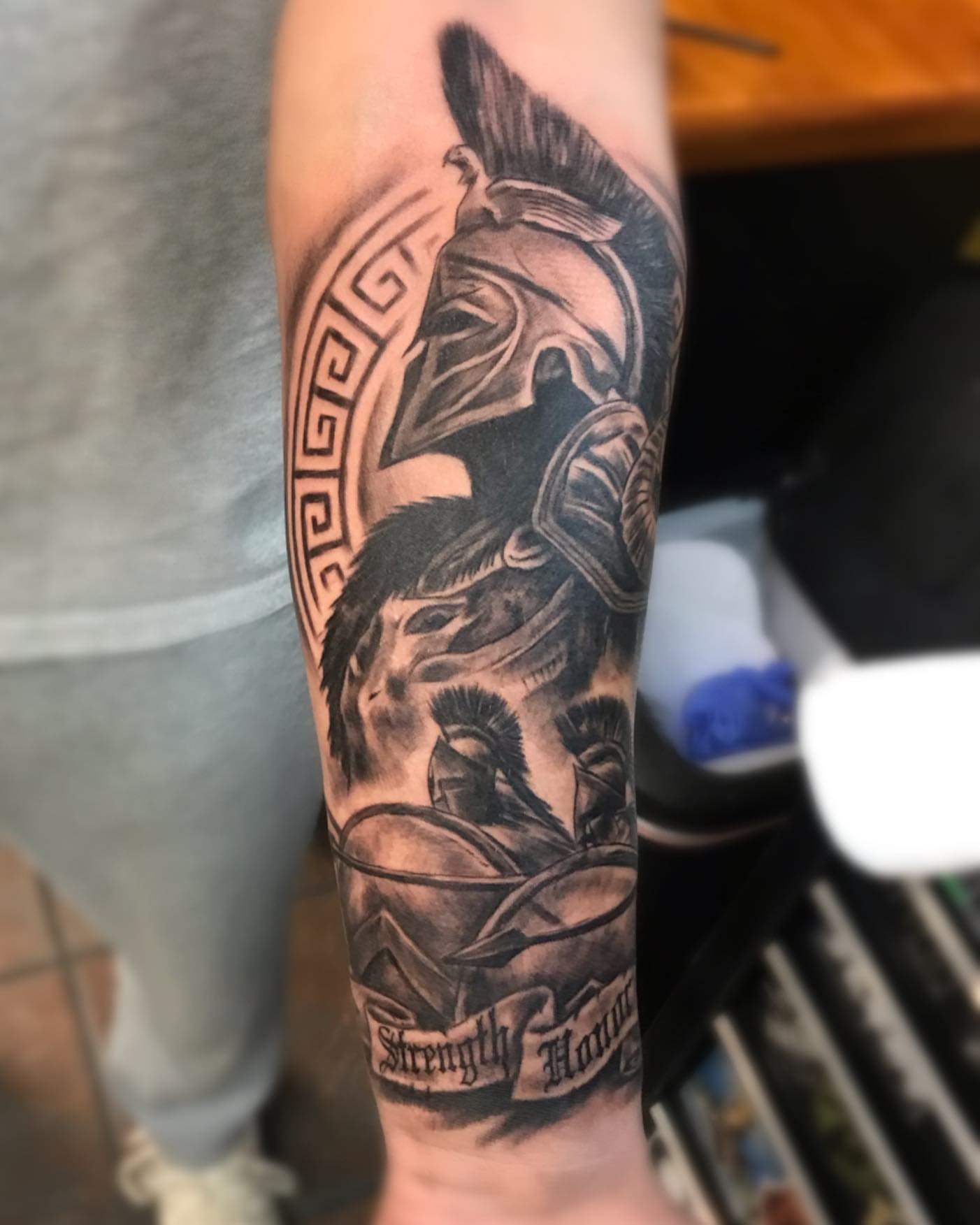 Spartan warrior realism tattoo on the forearm by Comfy Chris Fettig