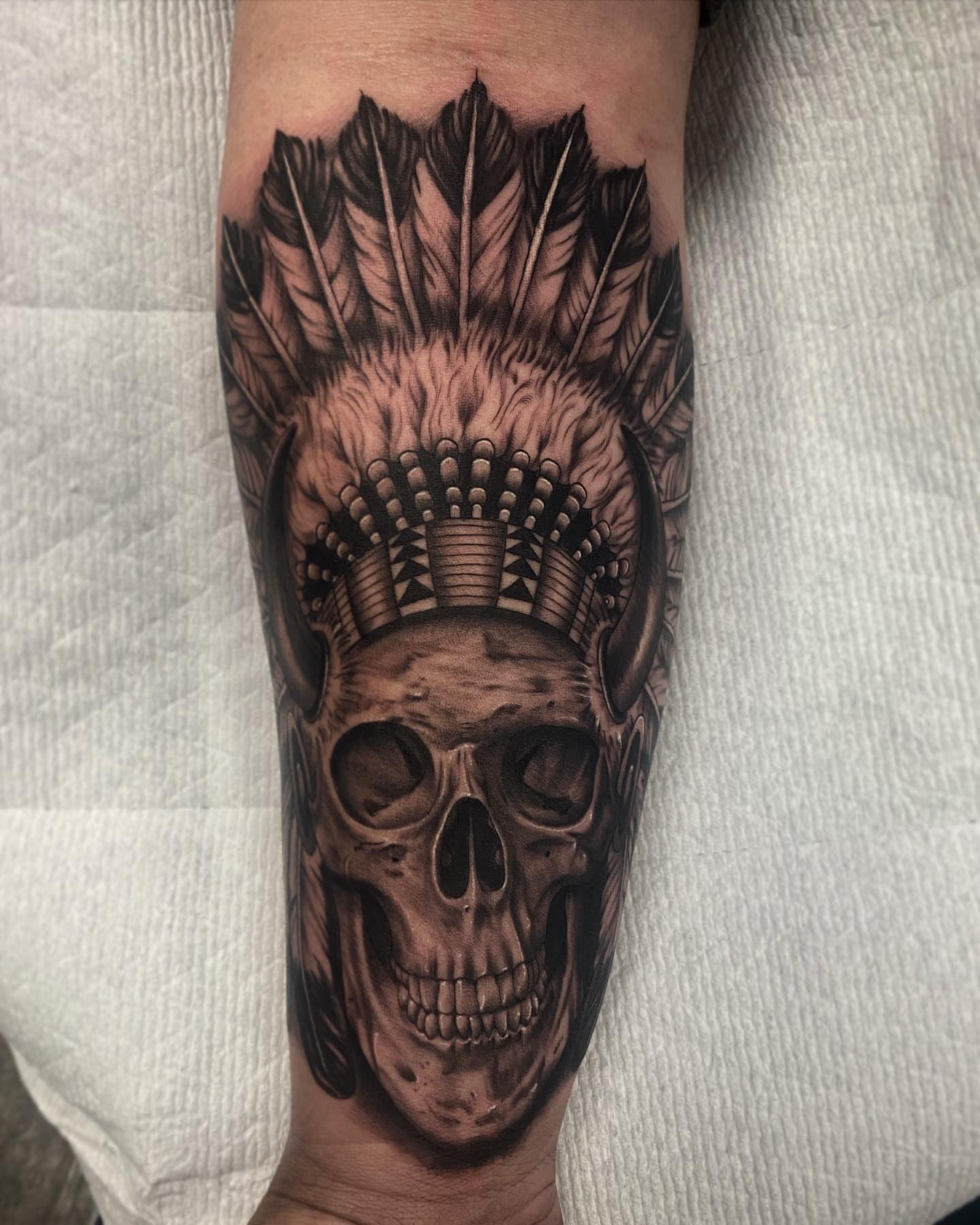 Skull with headdress realism tattoo on the forearm by Nick Bridwell, Downey, California