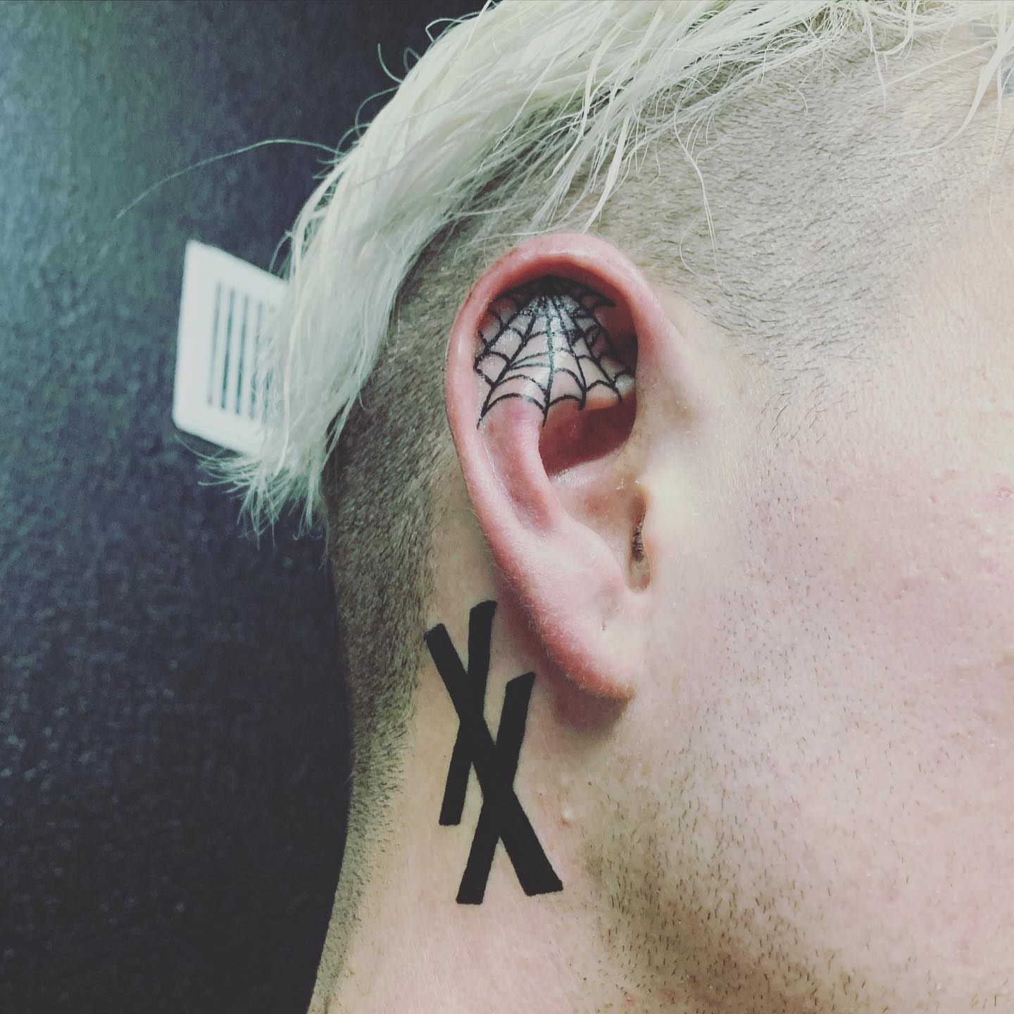 Spiderweb black and grey tattoo on the neck by Wichita Tattoo