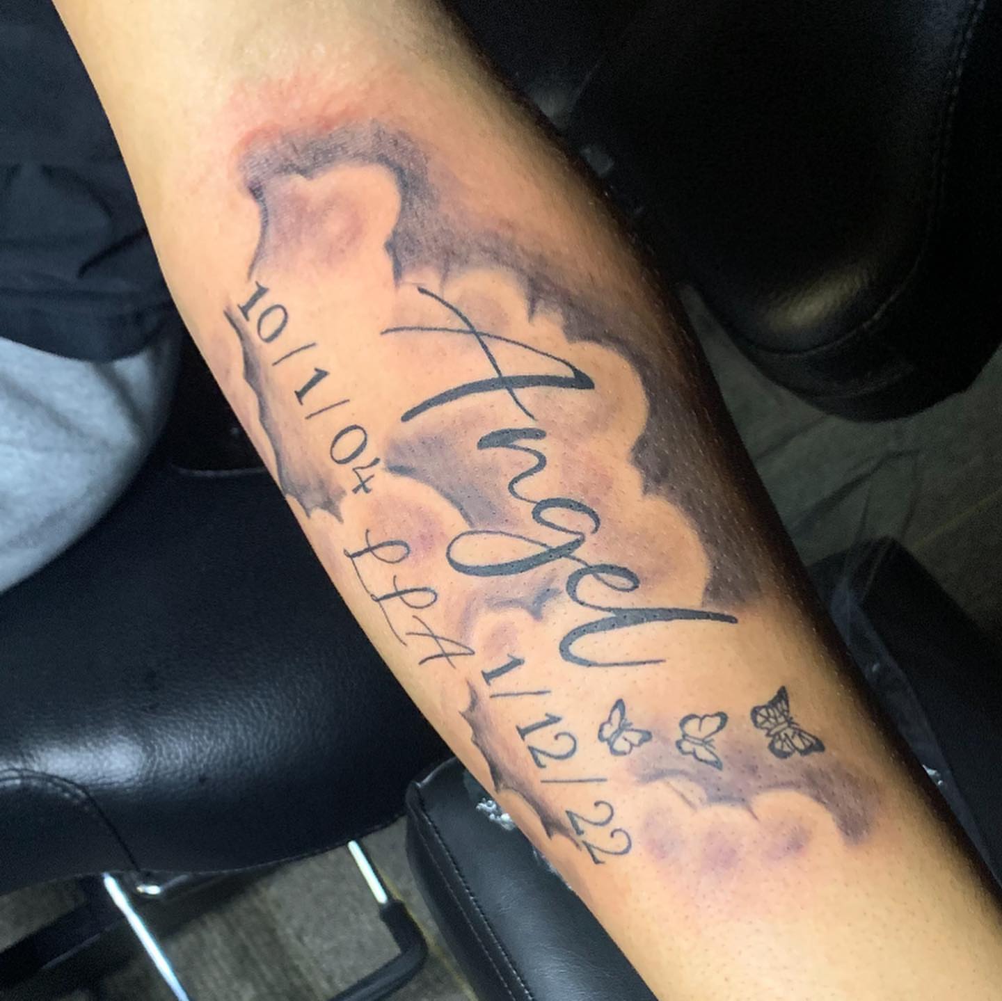 Angel lettering script tattoo on the forearm by Wichita Tattoo