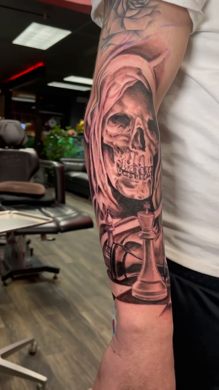 Tattoo by @nik__ink — dark_realism, black_and_grey
