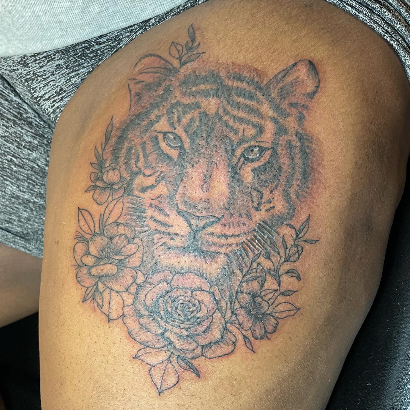 Tiger with flowers realism tattoo on the thigh by Breanna💉🔮, Dover, Delaware