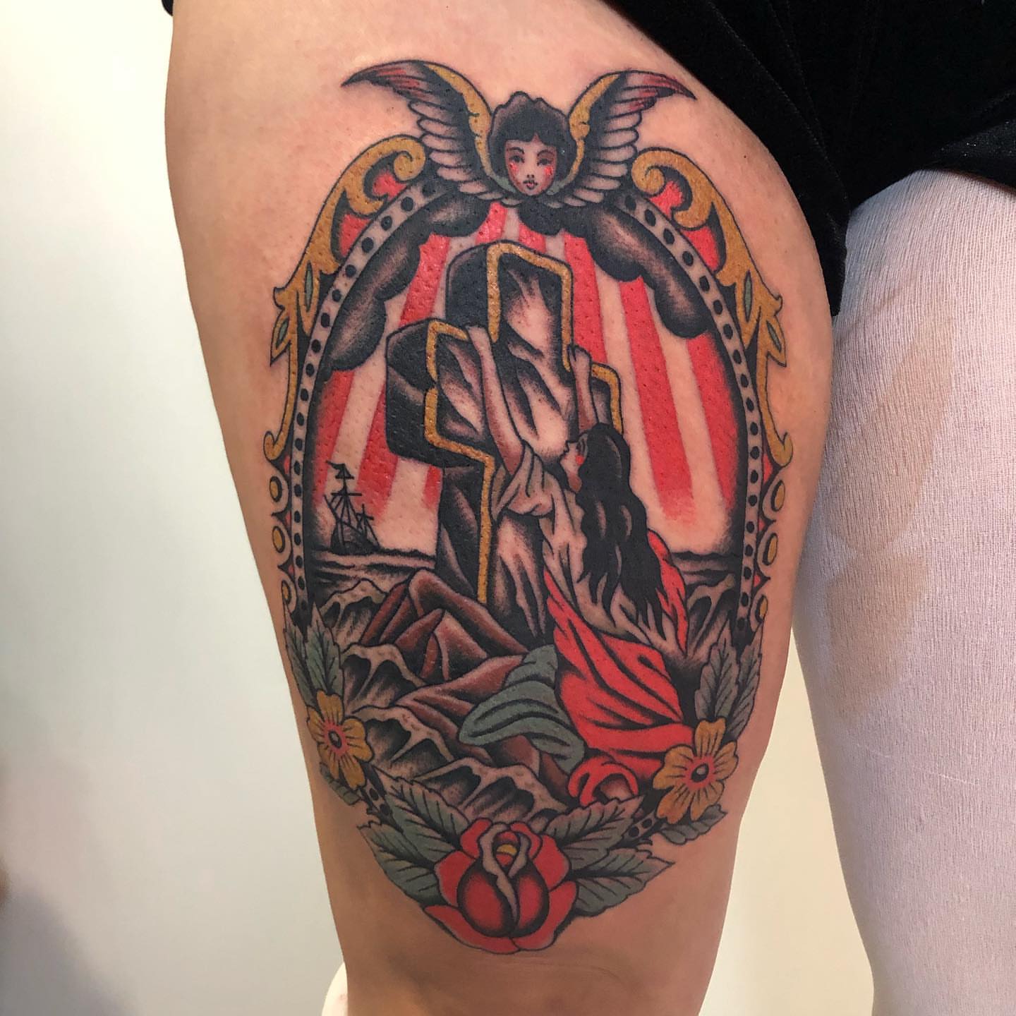 Religious scene American traditional tattoo on the thigh by Sean McMahon