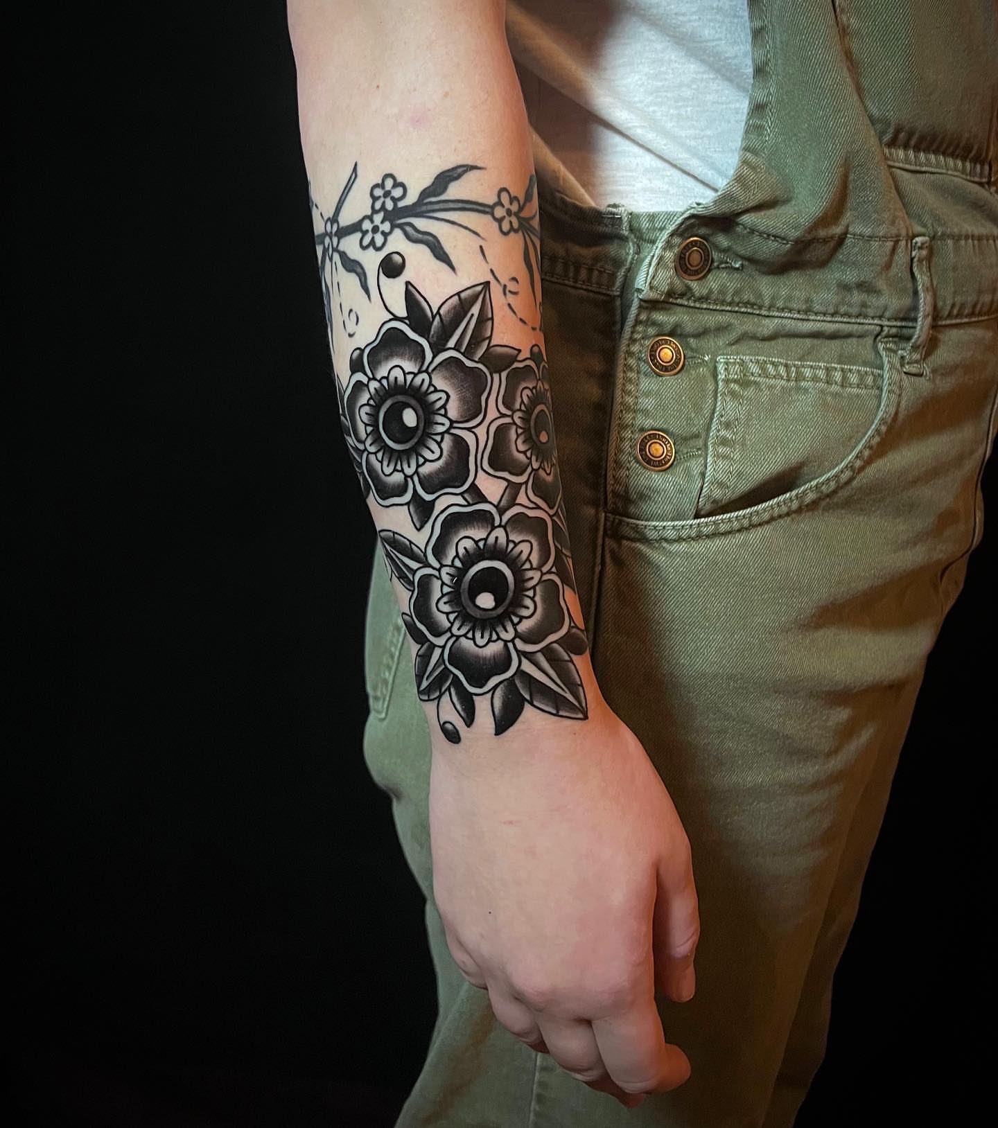 Floral bouquet black and grey tattoo on the forearm by David Mendieta