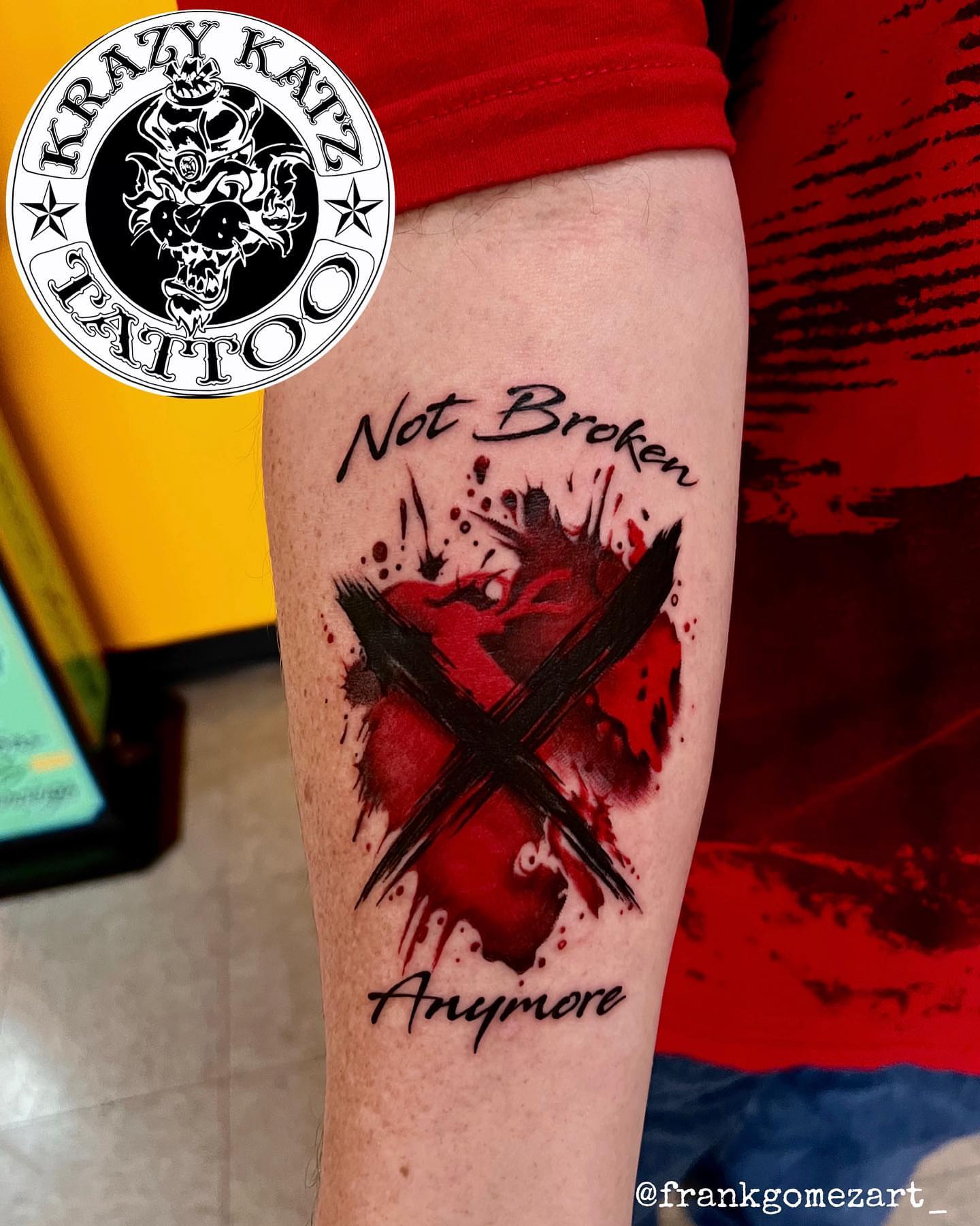 Blood splatter with cross realism tattoo on the forearm by Frank Gomez 🎨