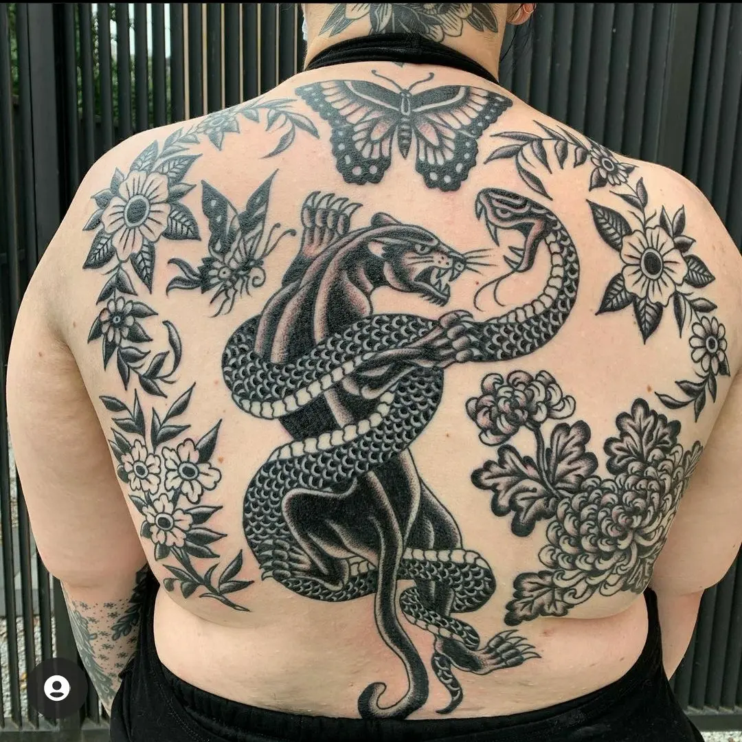 Snake and panther American traditional tattoo on the back by Jacci Gresham