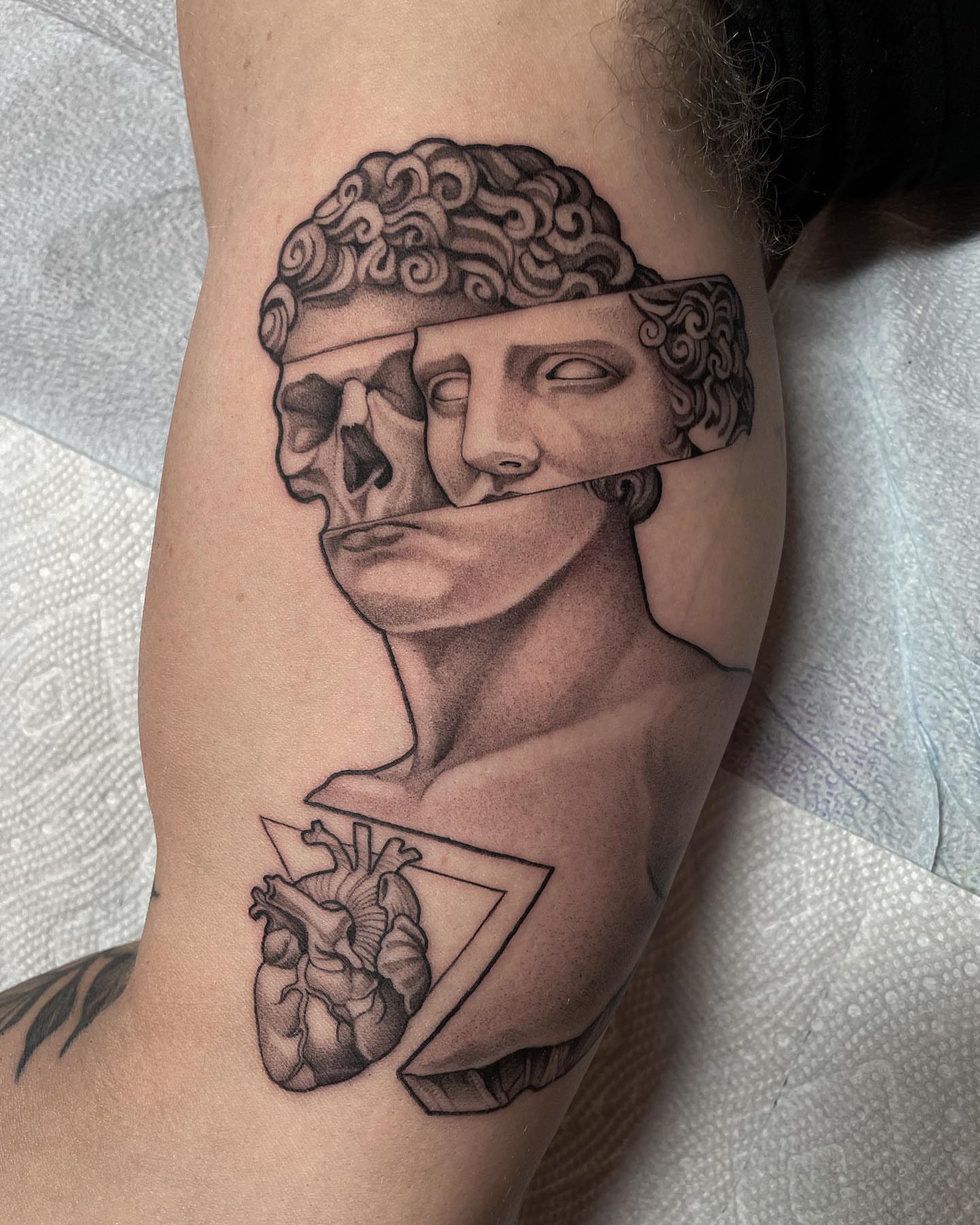 Statue realism tattoo on the forearm by Madelyn Roberts, Bellingham, Washington