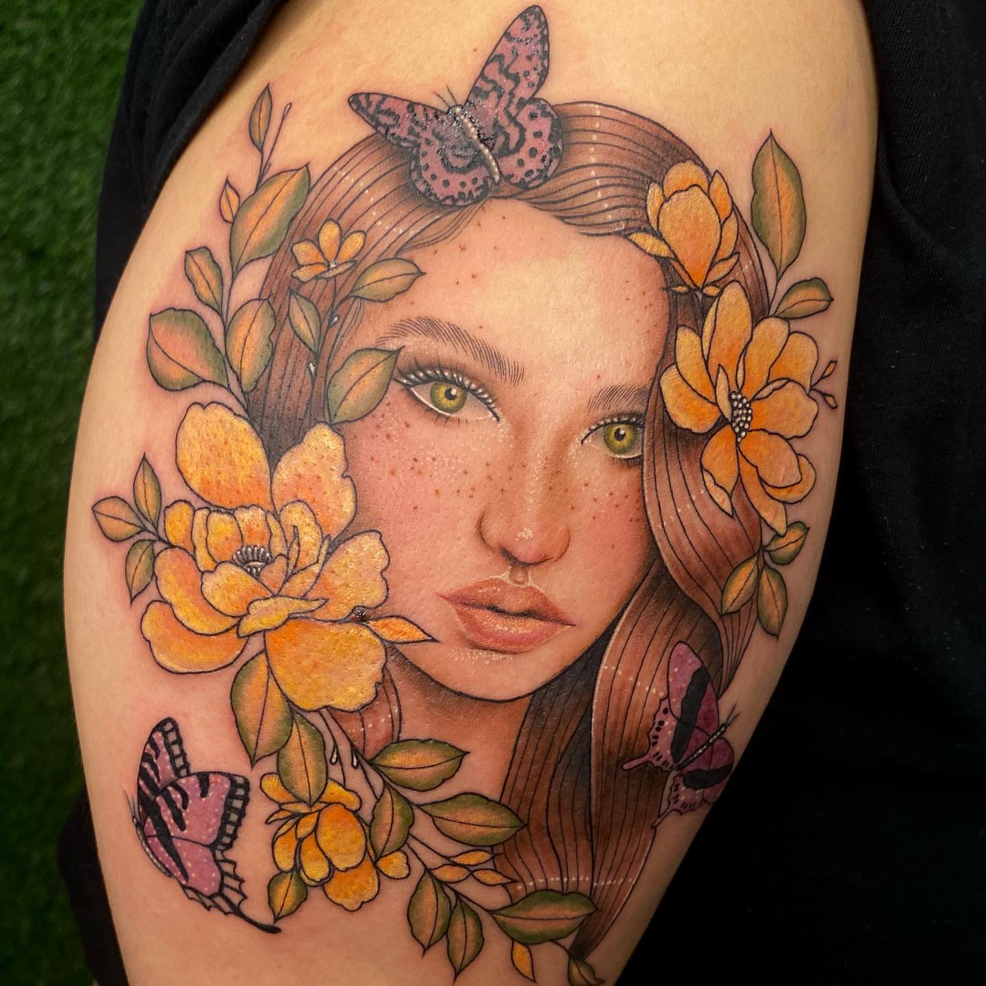 Woman with flowers and butterflies realism tattoo on the shoulder by ✨ Jaden Belle Tattoos ✨