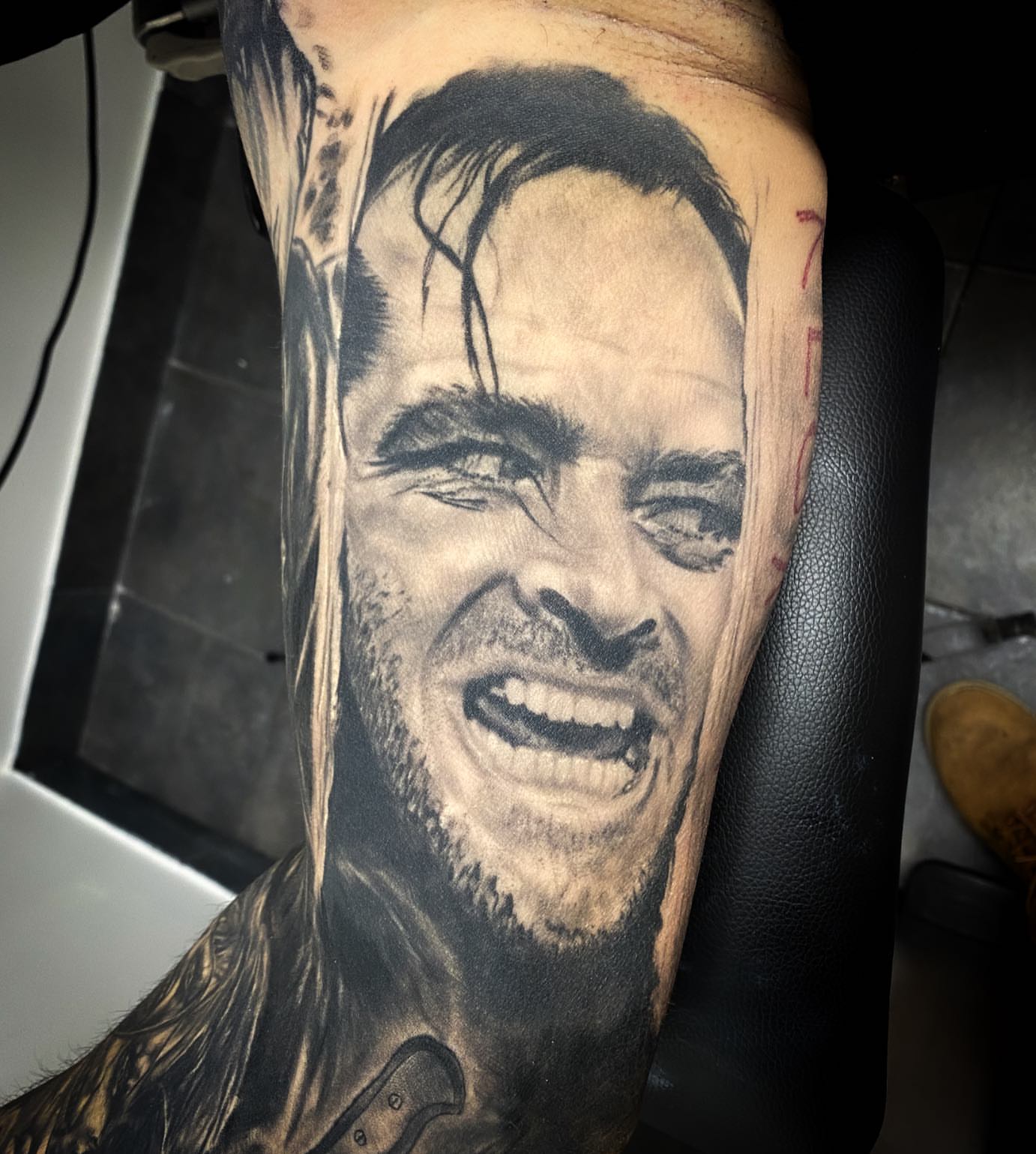 Portrait realism tattoo on the forearm by Lauren Schwier