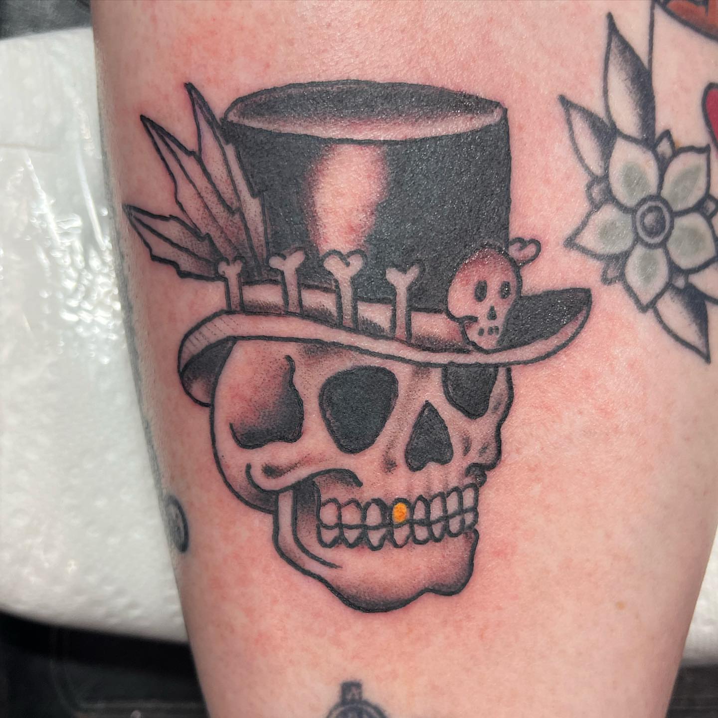 Skull wearing top hat American traditional tattoo on the forearm by IdleHandsFlex, New Orleans, Louisiana