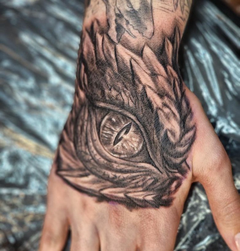 Owl realism tattoo on the hand by Comfy Chris Fettig