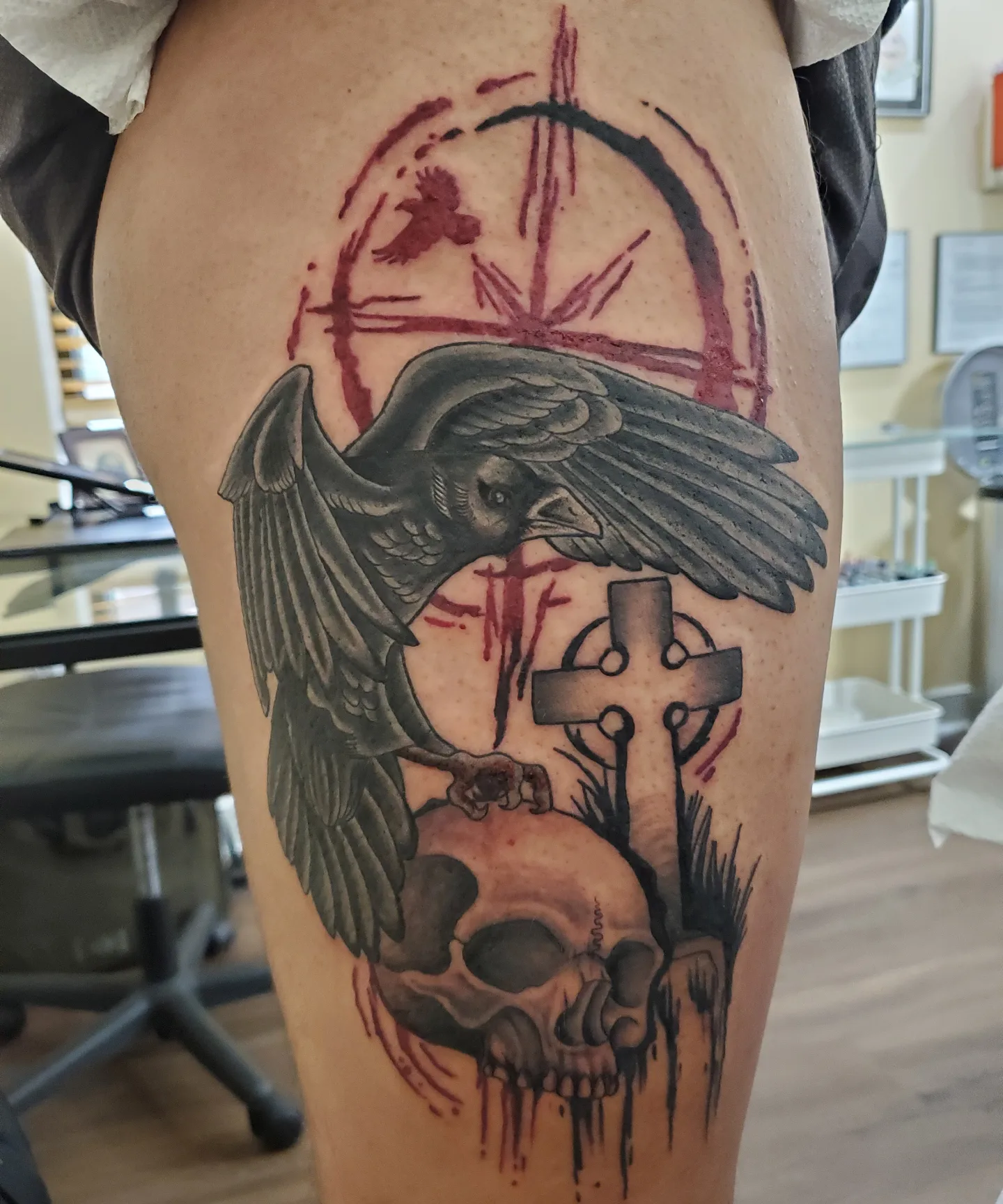 Crow and skull realism tattoo on the thigh by Ginny McCormick, Richmond, Virginia