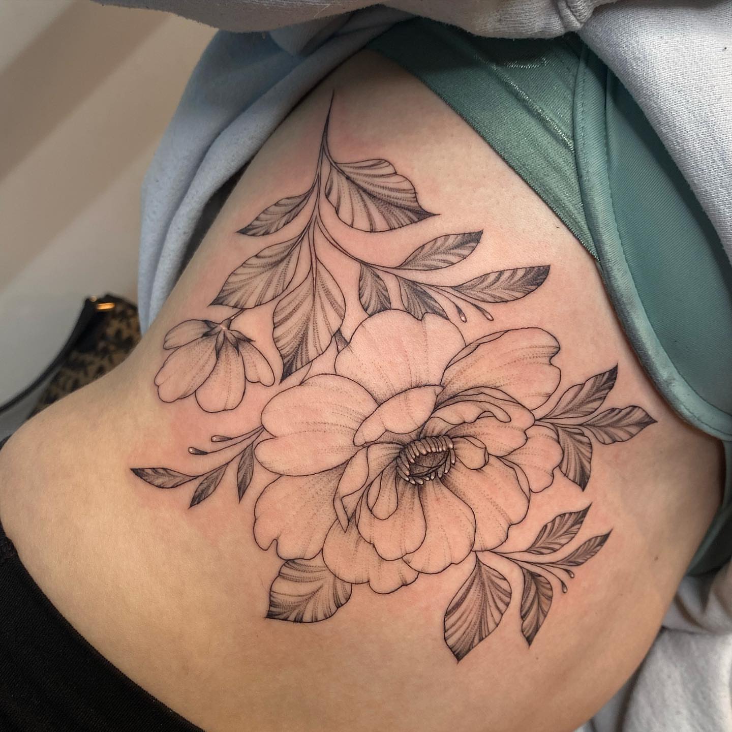Floral bouquet black and grey tattoo on the thigh by ✨ Jaden Belle Tattoos ✨