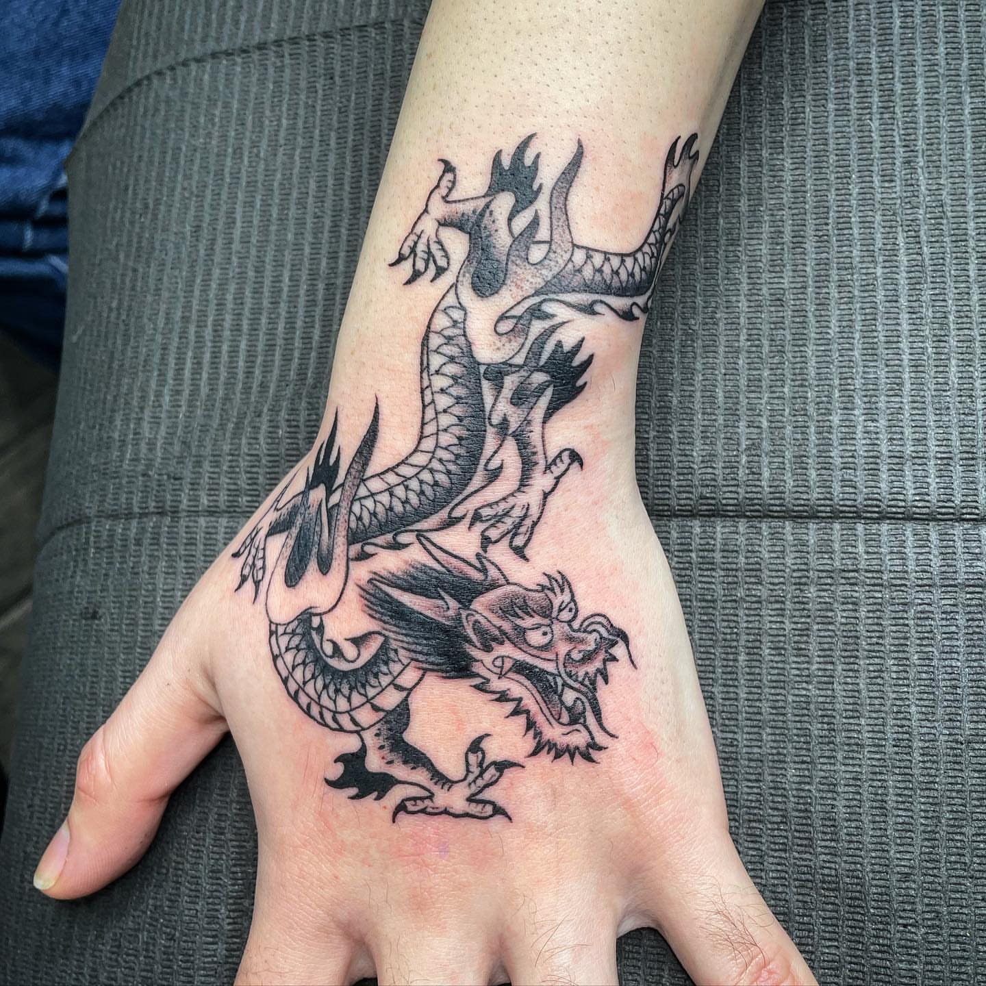Dragon black and grey tattoo on the hand by Yari, Los Angeles, California