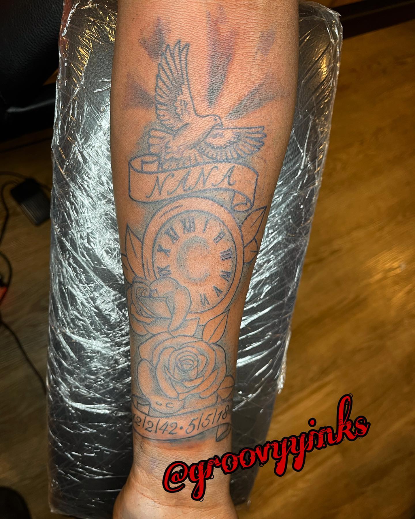 Clock and dove black and grey tattoo on the forearm by groovyyinkss
