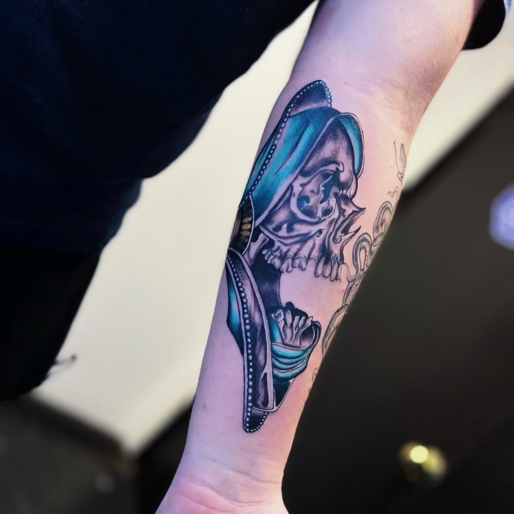 Skull wearing sombrero realism tattoo on the forearm by Edward A. Boesch
