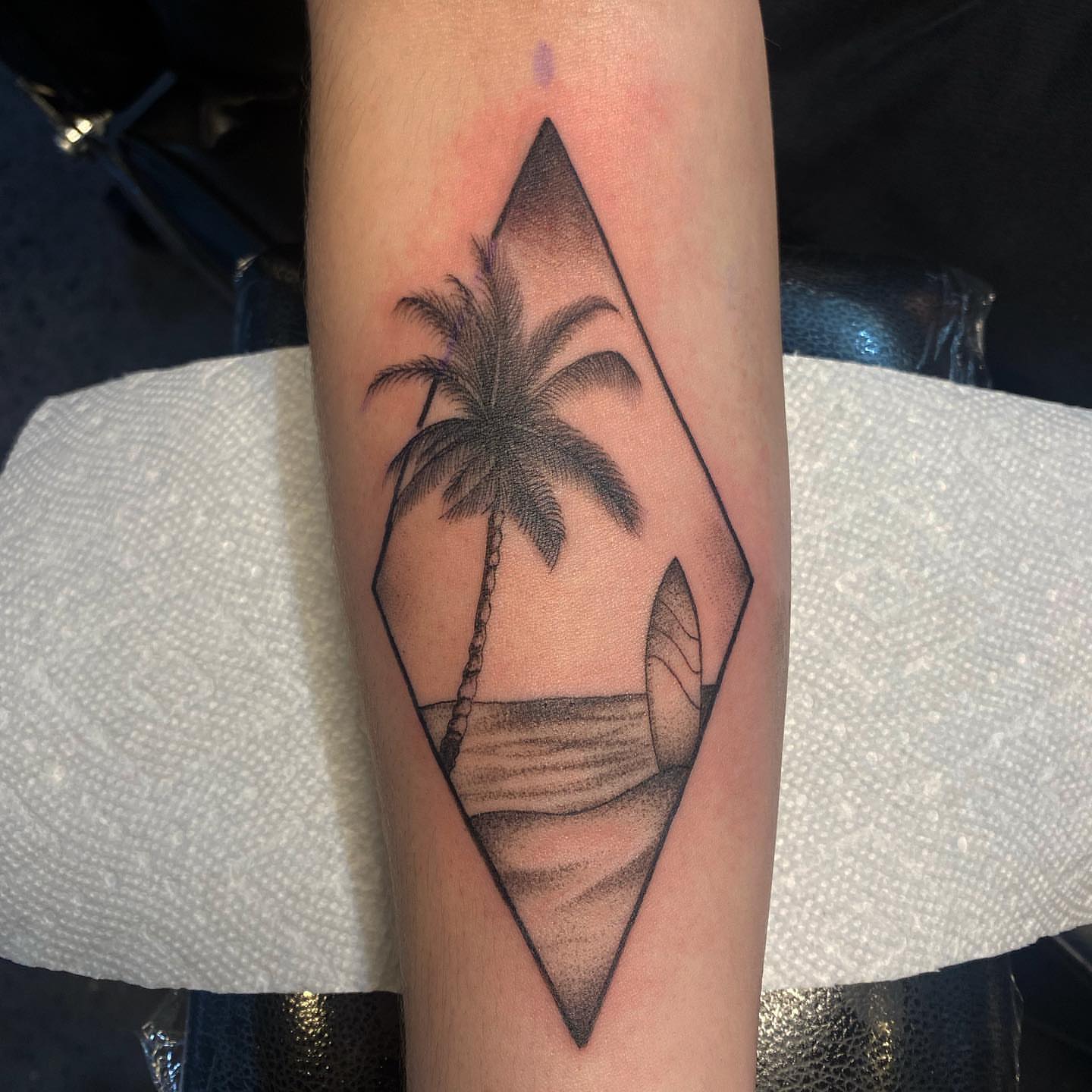 Palm tree geometric tattoo on the forearm by T, Saugus, Massachusetts