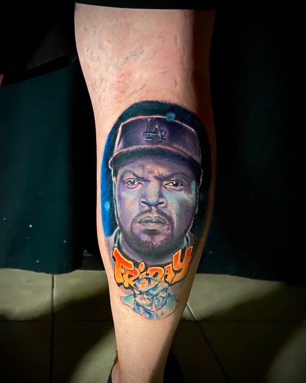 Eazy-E realism tattoo on the leg by Zach Ashton