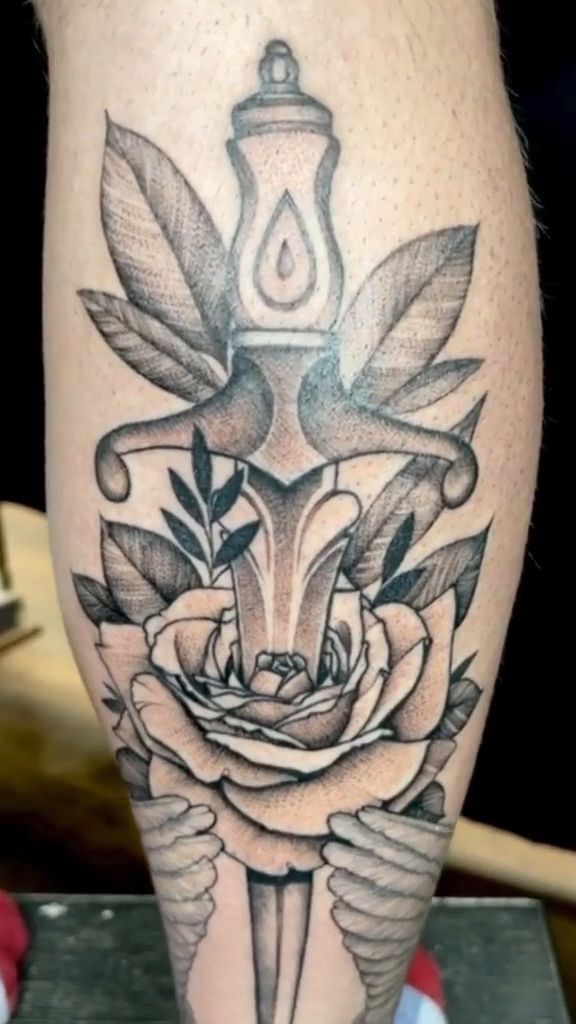 Dagger and rose American traditional tattoo by Ruby Gore, Portland, Oregon