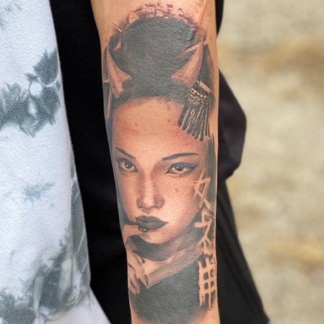 Geisha portrait realism tattoo on the forearm by Augie Stakes