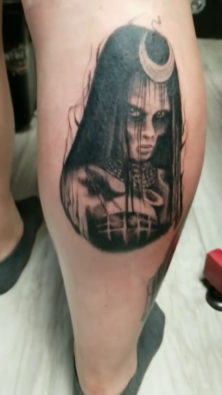 Woman with crescent moon dark realism tattoo by Chris TL Jones