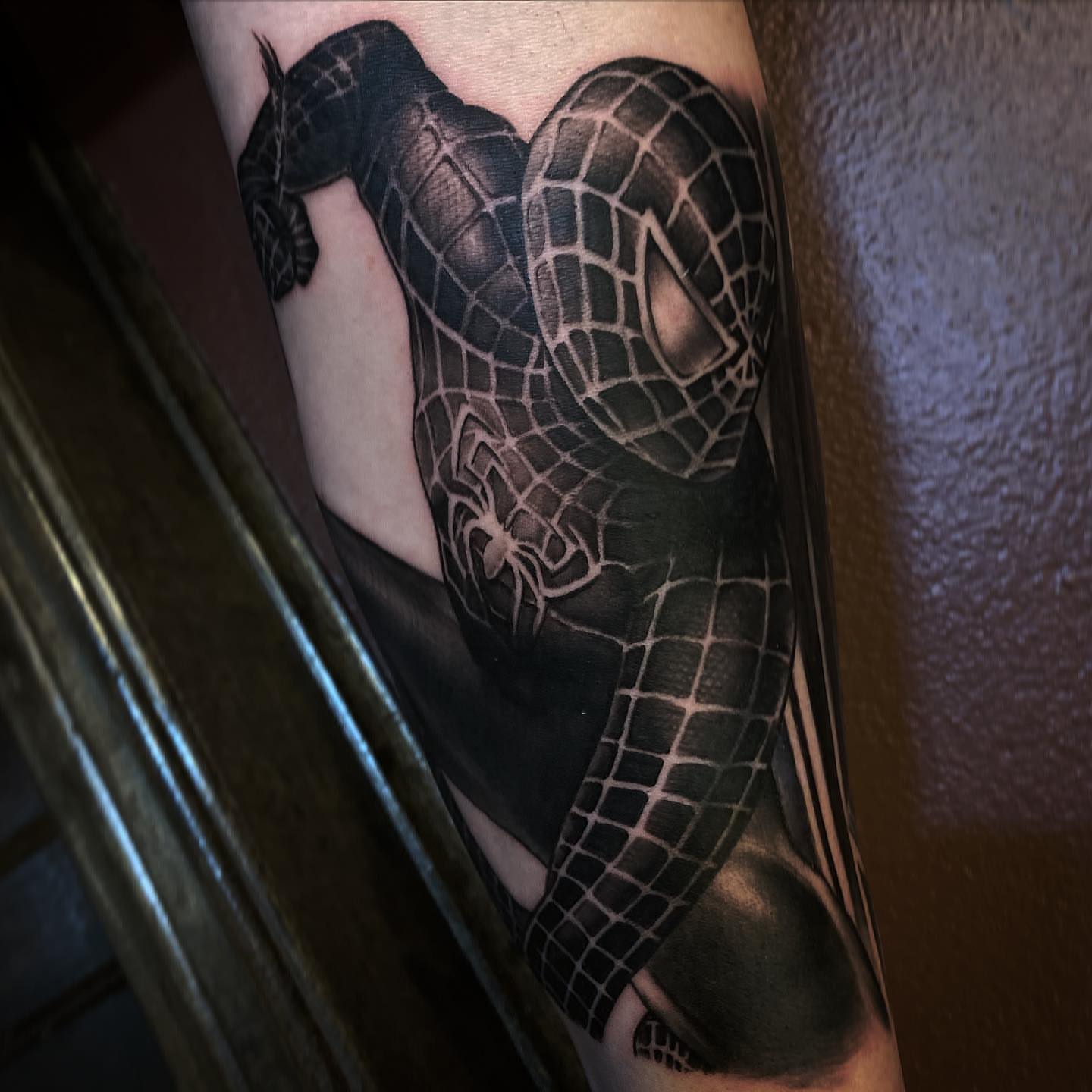 Spiderman suit black and grey tattoo on the forearm by ⠀⠀ ⠀ ⠀ ⠀⠀ ⠀⠀ ⠀⠀ ⠀ ⠀⠀ ⠀⠀ᎪᎳᏃ, West Hollywood, California