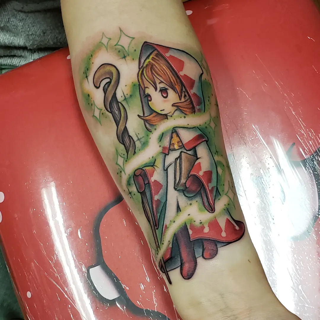 Anime character anime tattoo on the forearm by Don Taylor