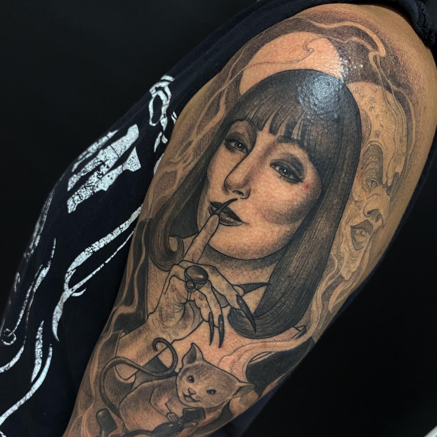 Woman with cat realism tattoo on the upper arm by Marissa Tattoos