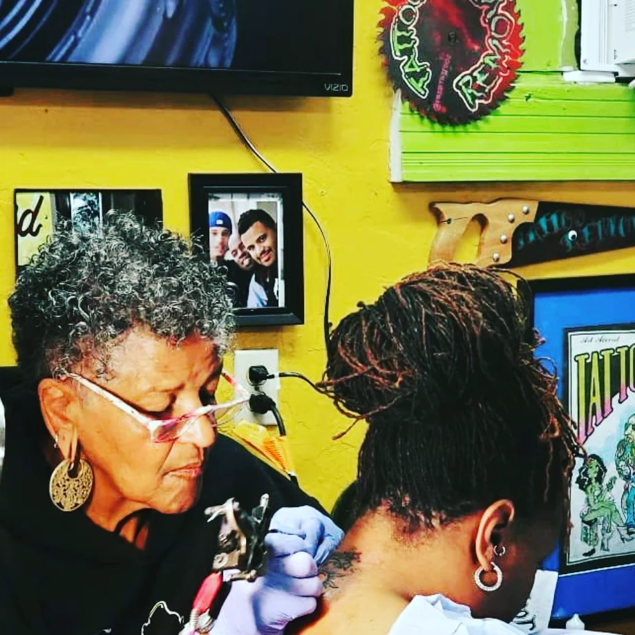 Tattoo artist American traditional tattoo on the neck by Jacci Gresham