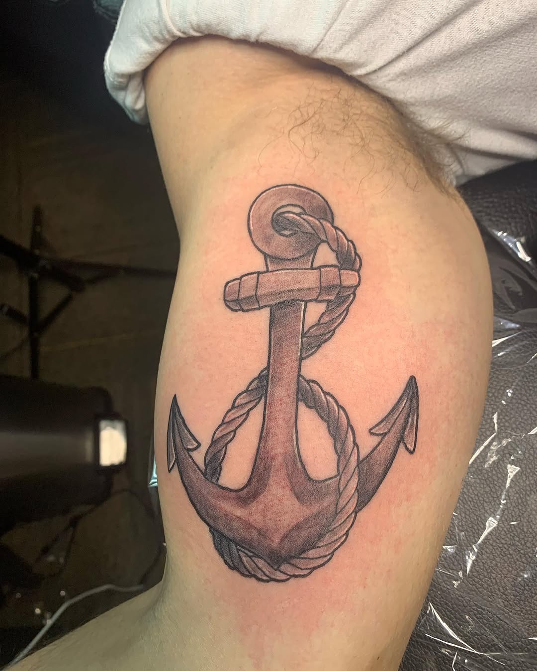 Anchor with rope realism tattoo on the thigh by Wichita Tattoo