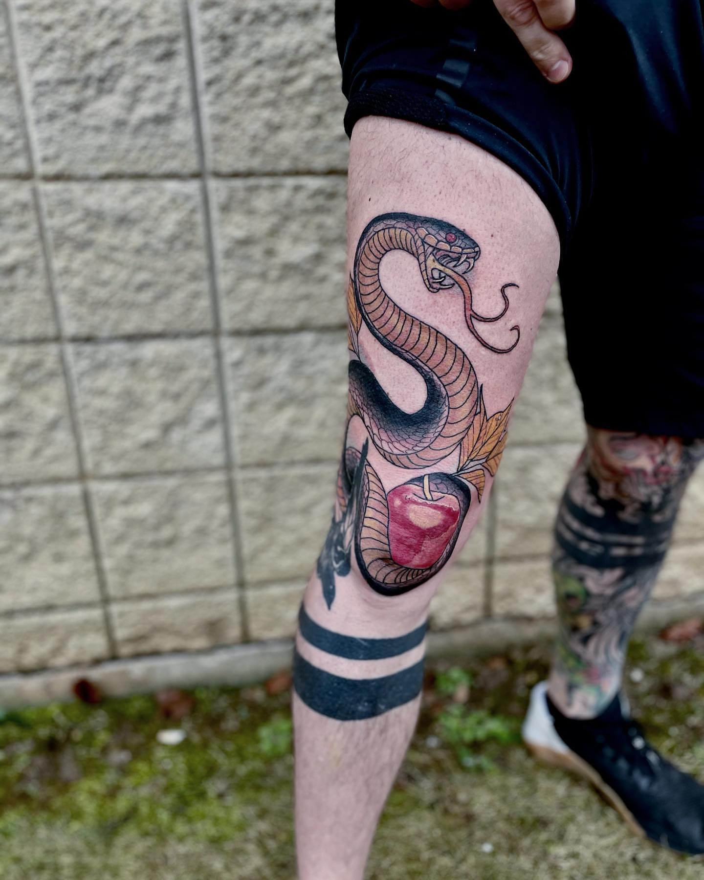 Snake and apple American traditional tattoo on the thigh by ๐๐ฌ๐ฐ๐ฅ ๐๐ฌ๐ฌ๐ซ