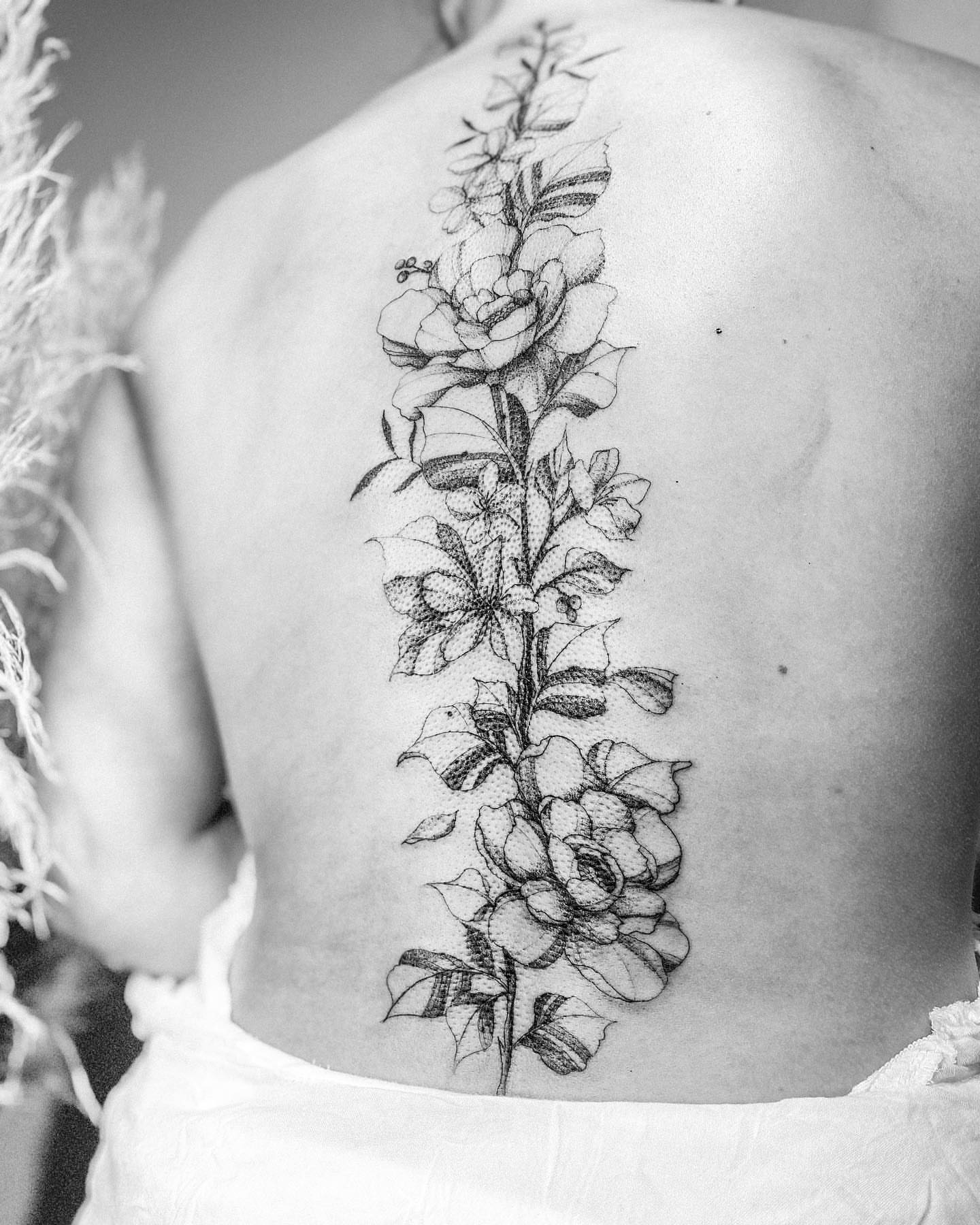Floral arrangement black and grey tattoo on the back by Ayauna Mai