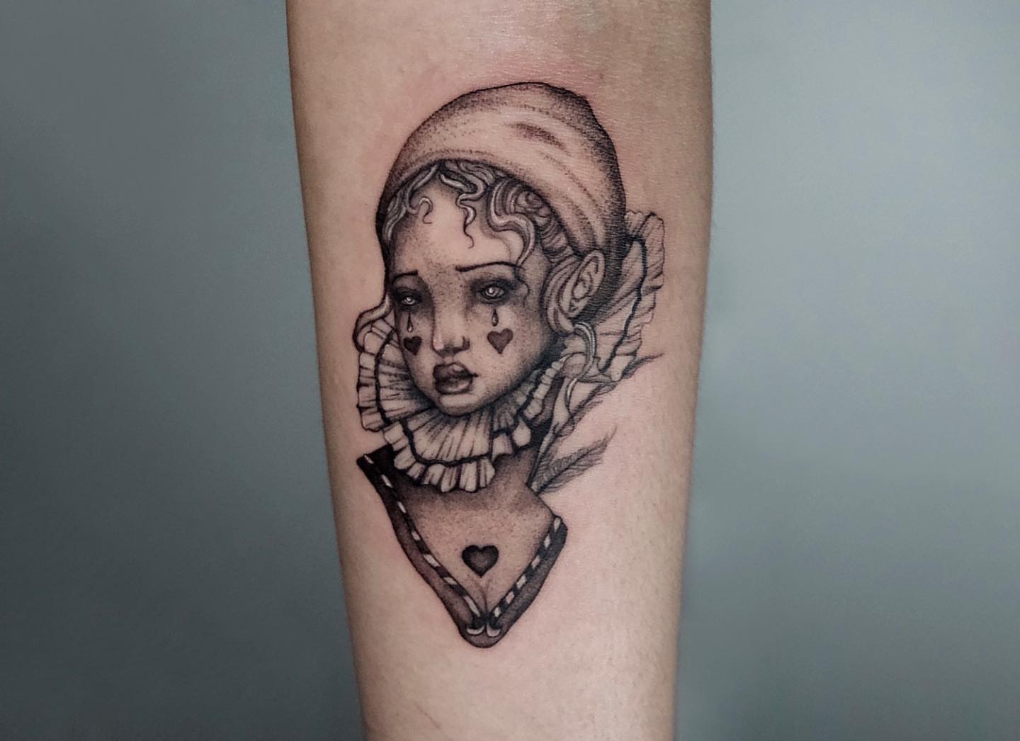 Child with ruffled collar realism tattoo on the forearm by Priscila, Los Angeles, California