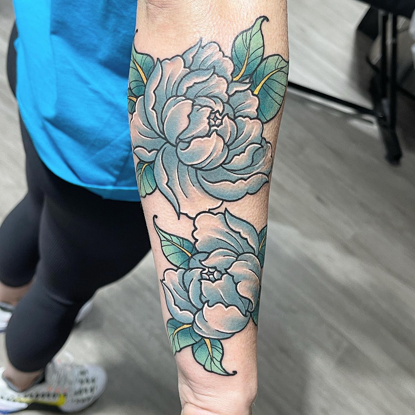 Peony flowers American traditional tattoo on the forearm by Zack Havoc