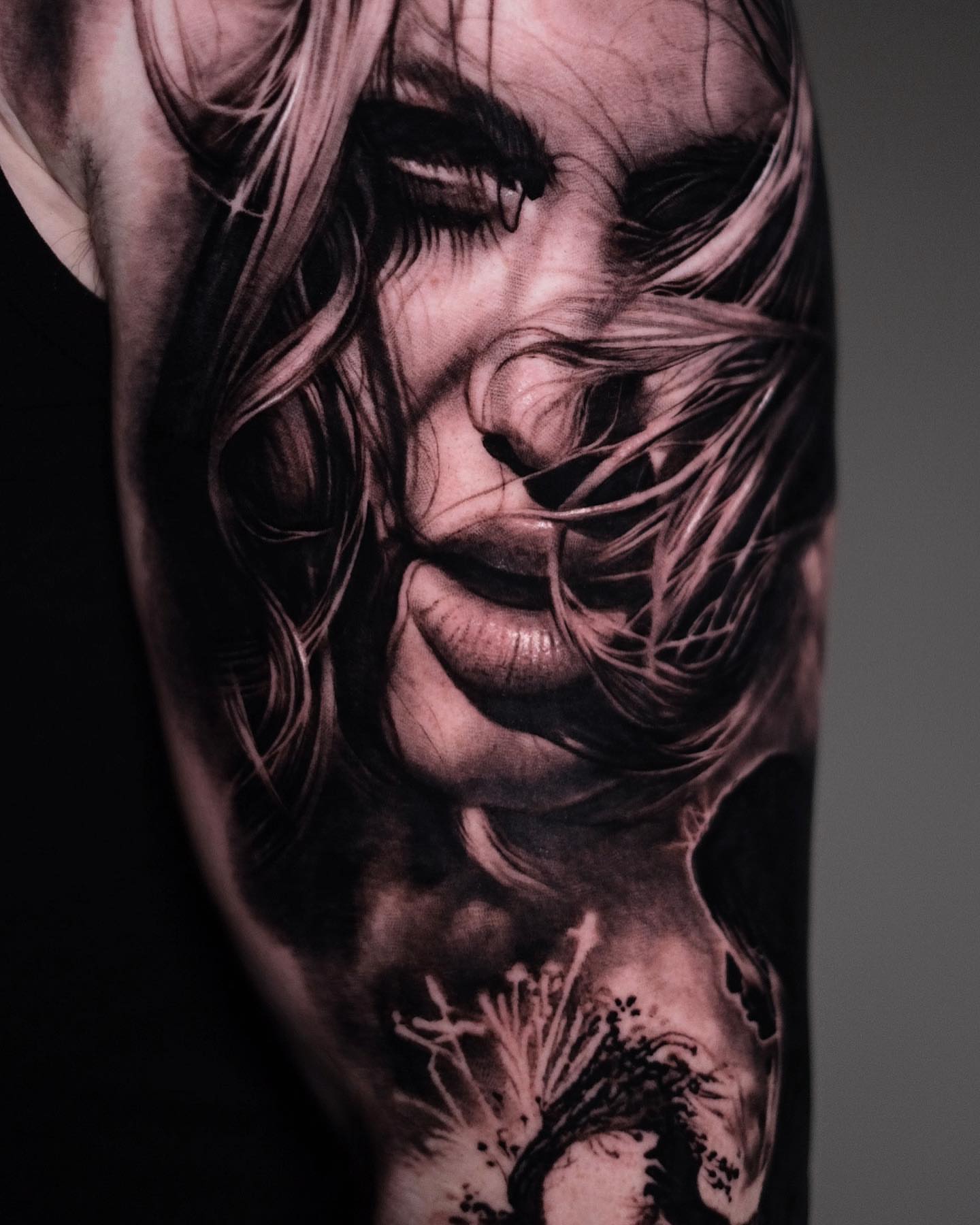 Windblown woman realism tattoo on the forearm by Anton Martiushev