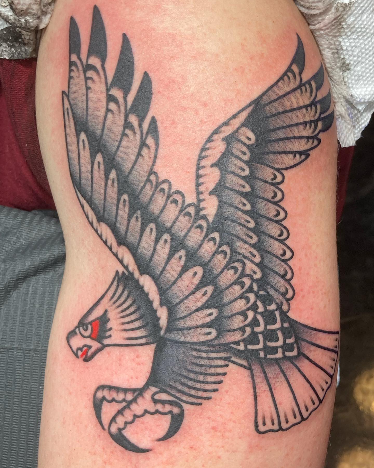 Hawk American traditional tattoo on the thigh by Rob Banks