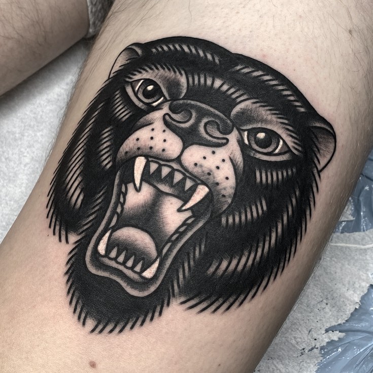 Angry bear black and grey tattoo on the thigh by andrewtattoos