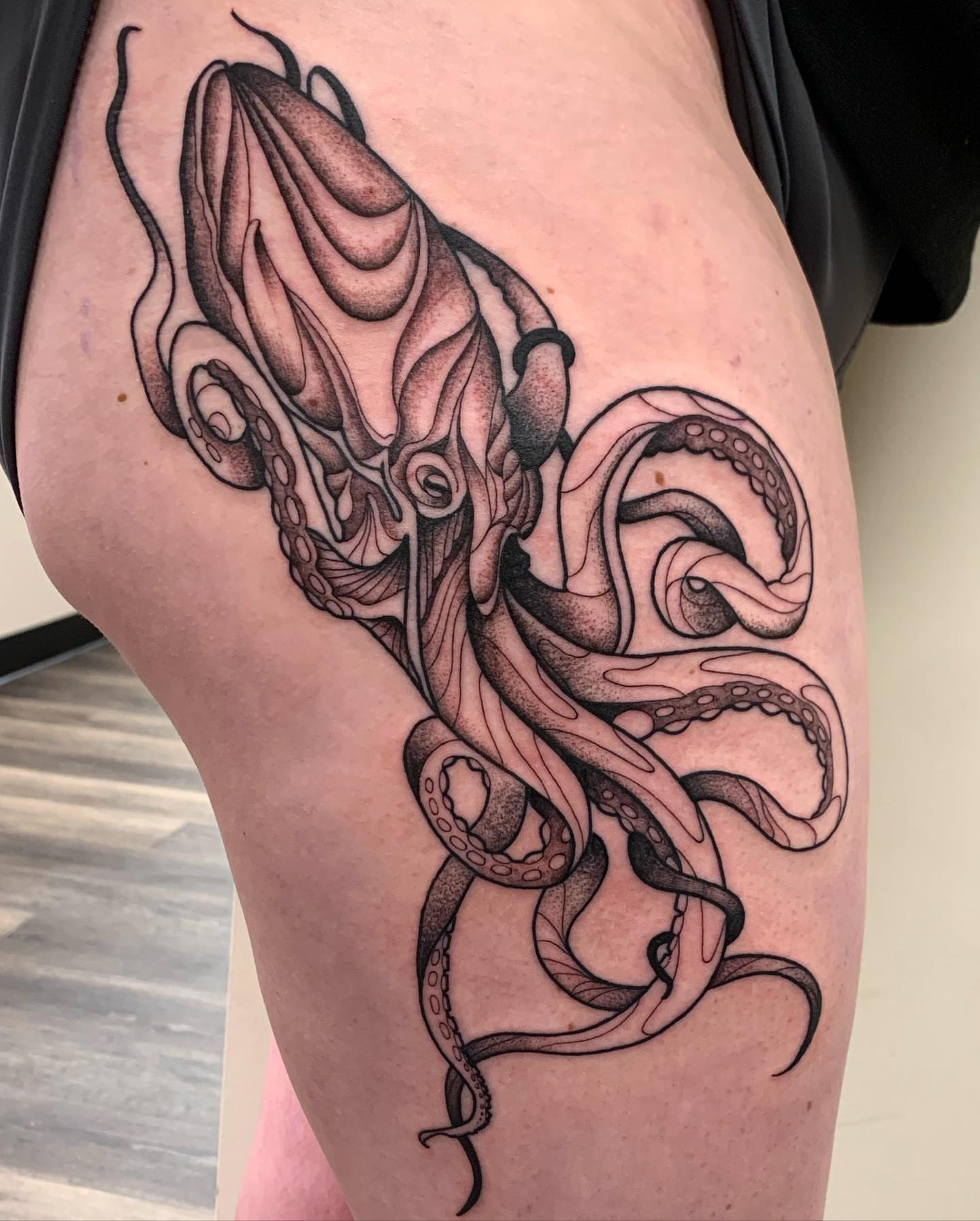 Octopus black and grey tattoo on the thigh by Jacob Deirfield, Circleville, Ohio