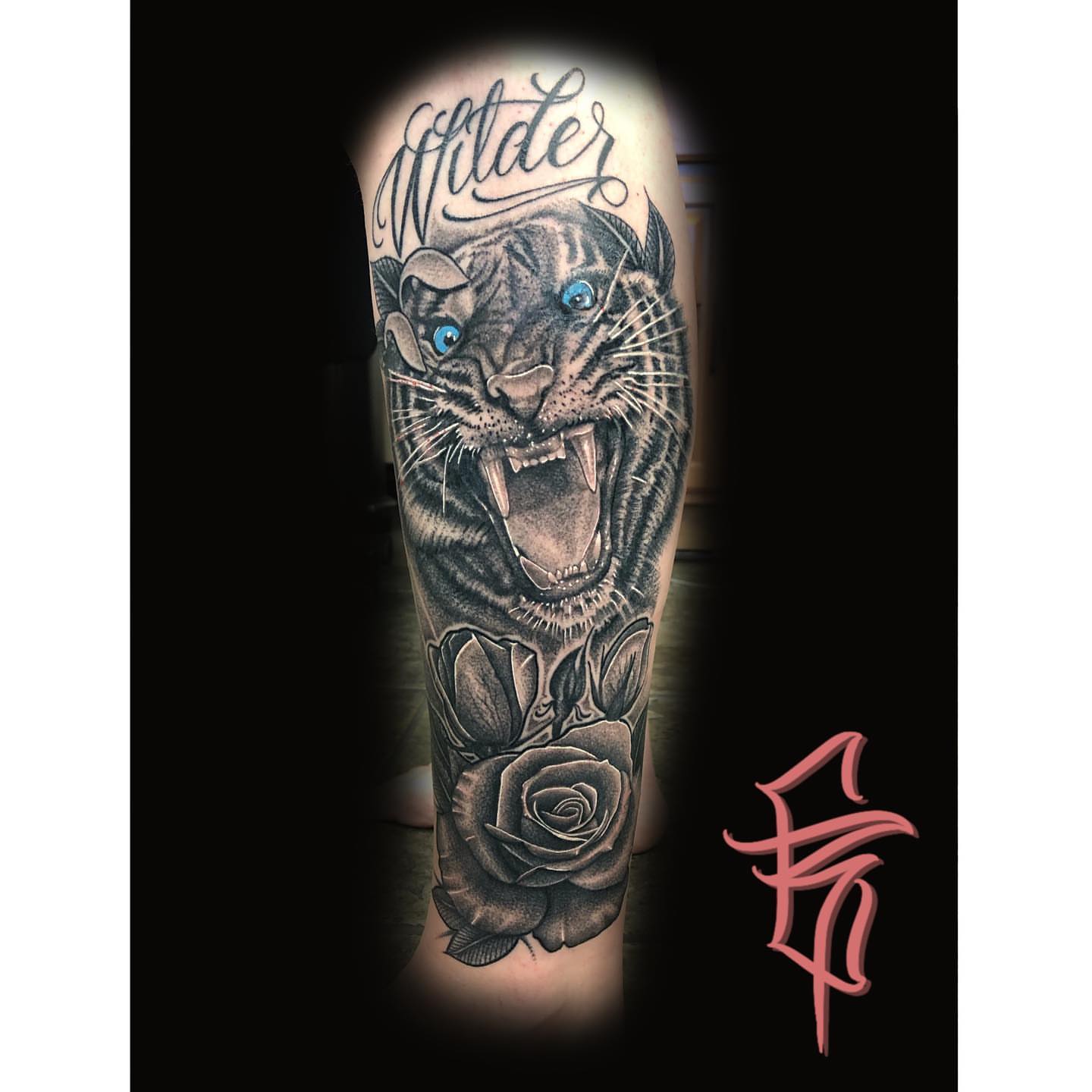 Panther and roses realism tattoo on the forearm by Fullerton ca tattooing