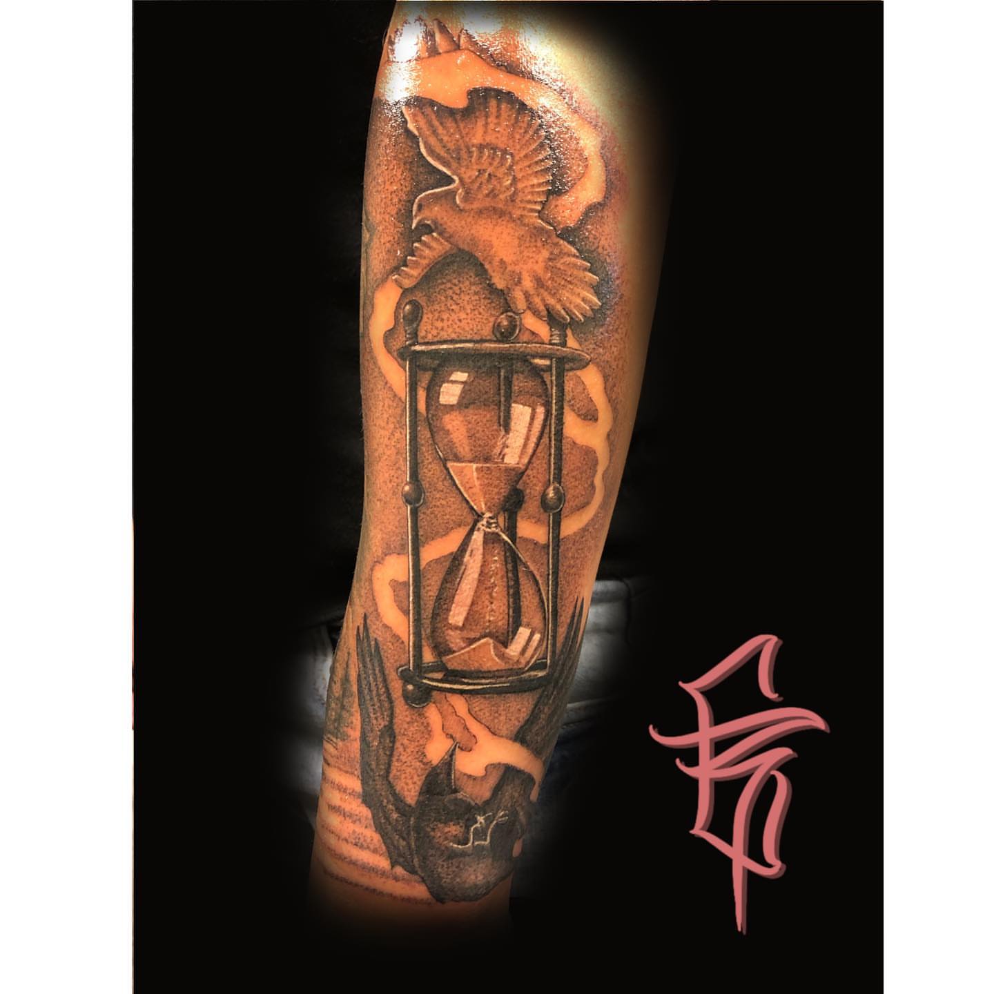 Hourglass and eagle black and grey tattoo on the forearm by Fullerton ca tattooing